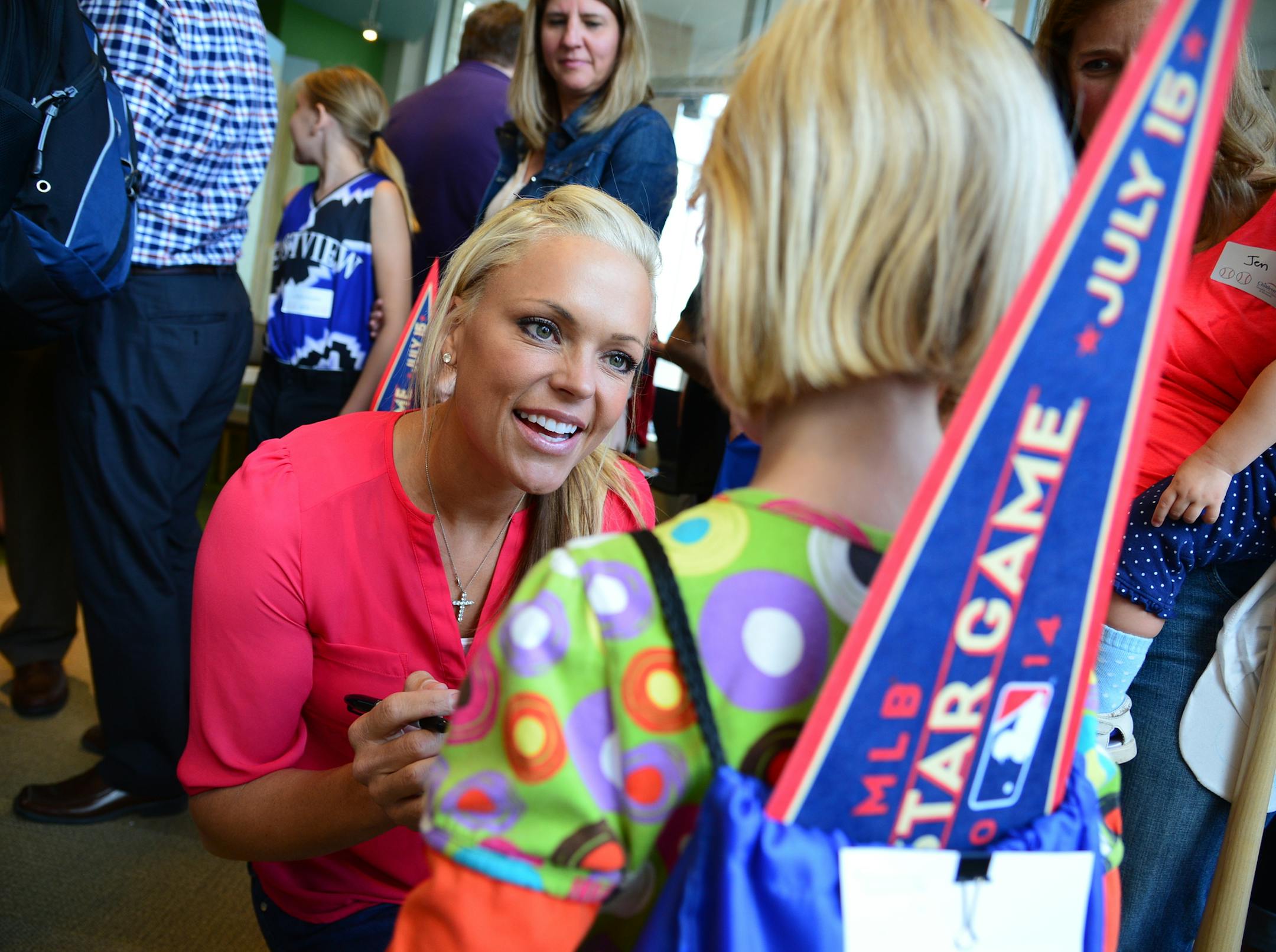 Jennie Finch US olympic Gold Medal softball pitcher chatted with 7 year old Millie Muller of Edina who gave her an autographed baseball card. Children's Hospital held an event to celebrate the upcoming 2014 MLB All-Star festivities.A number of celebrities, professional athletes and other sports personalities will be participating in the event, signing and collecting their own autographs from children who have their own baseball cards courtesy of Topps. The kids who are Children's Hospital patien