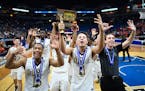 DeLaSalle players, including guards J.T. Baker (15) and Gabe Kalscheur (11), celebrated their sixth consecutive Class 3A boys' basketball championship