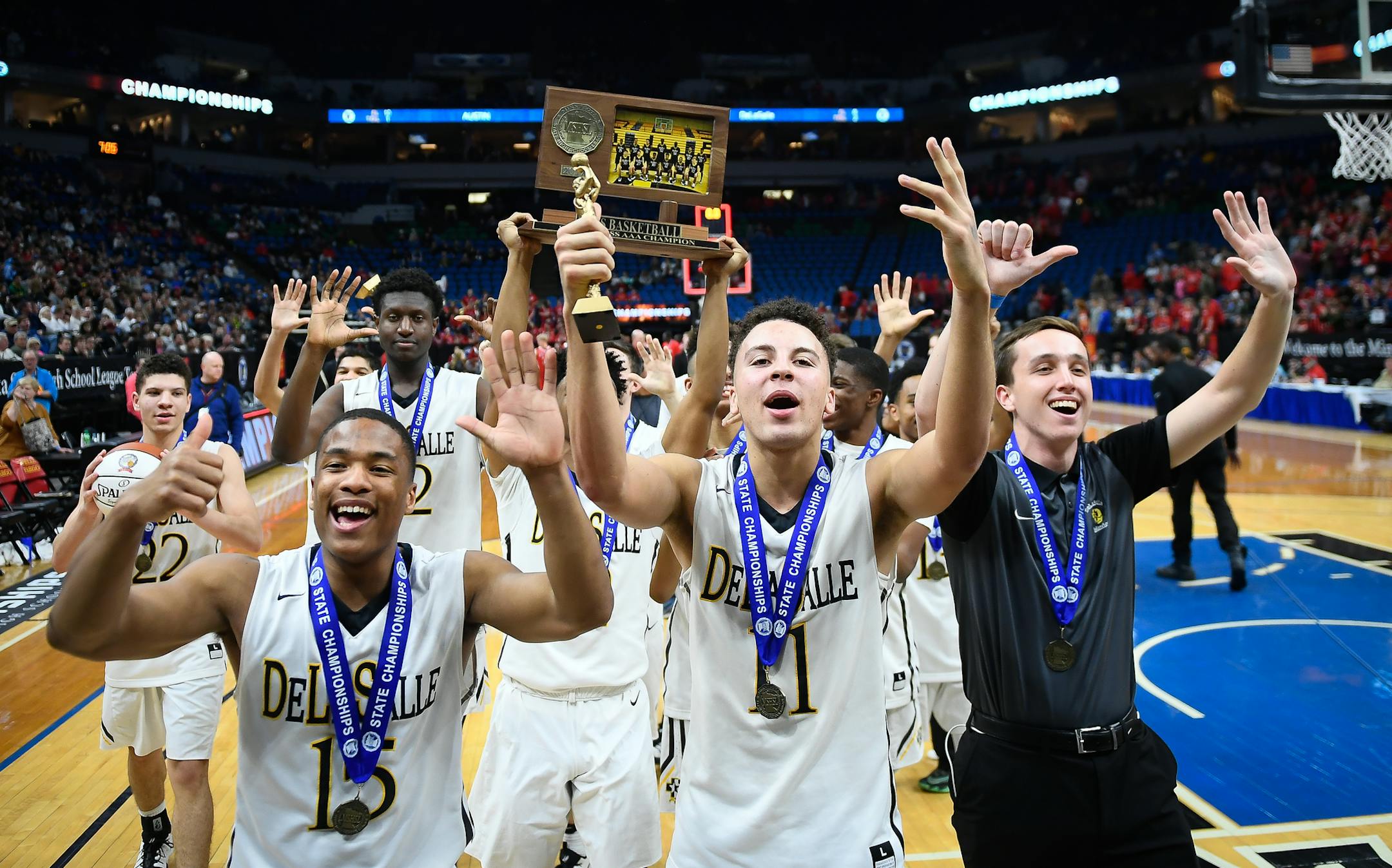 DeLaSalle players, including guards J.T. Baker (15) and Gabe Kalscheur (11), celebrated their sixth consecutive Class 3A boys' basketball championship.