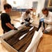 Megan Dischinger left , Eva D¸llo and Andrea Kn¸pfer, German textile conservators, unpacked a 16th century monks robe, the style that Luther wore, a