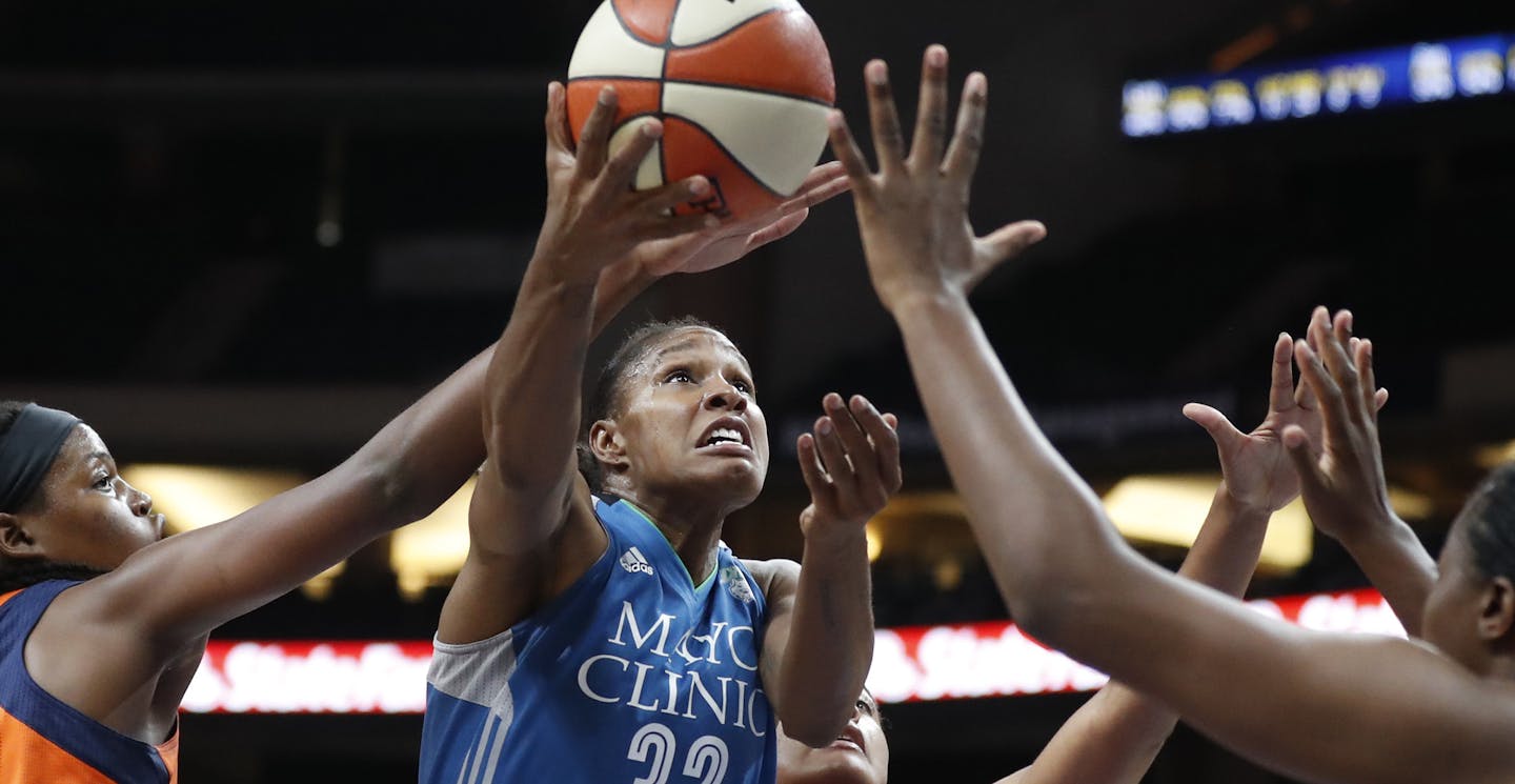 Minnesota Lynx forward Rebekkah Brunson (32) scored over Connecticut Sun forward Jonquel Jones (35) and Morgan Tuck (33) at Xcel Energy Center May 22, 2017 in St. Paul, MN. ] JERRY HOLT &#xef; jerry.holt@startribune.com