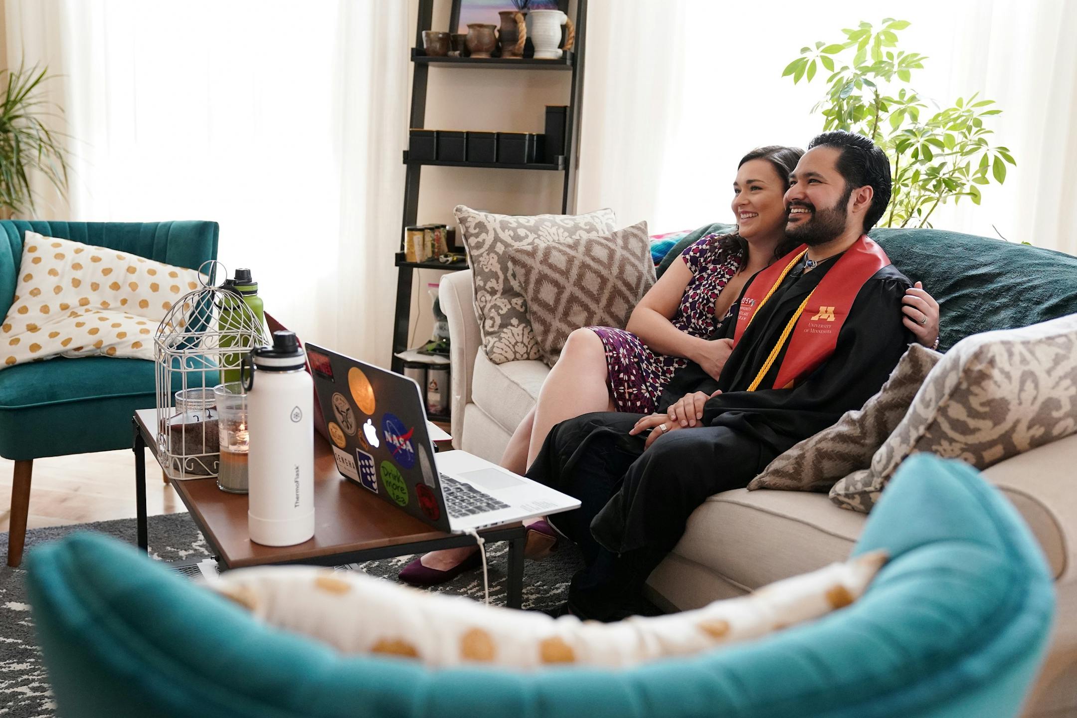 Izaak Mendoza watched the video commencement address in his graduation robes alongside his wife Becky and his family who were on a video call from their home in Wyoming Saturday.