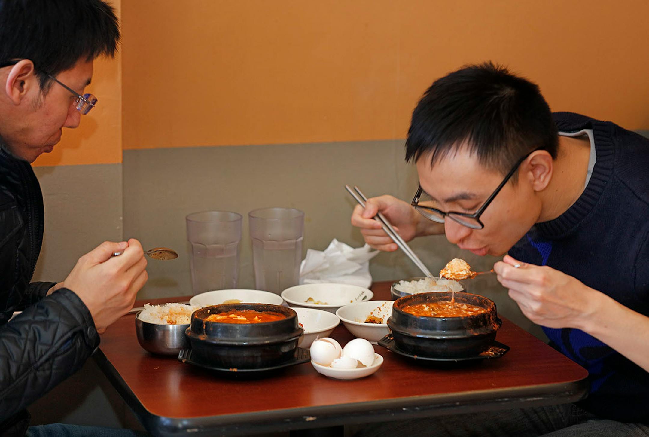 Left , Keping Song and Zisheng Zhung enjoy hot soup during lunch at Kimchi Tofu House, near the U of M in Minneapolis, specializes in spicy Korean soup called sundubu. It sells 12 varieties and customers can choose the level of spiciness, done by varying the amount of Korean chili flakes called gochugaru. ] Star Tribune/Tom Wallace • tom.wallace@startribune.com