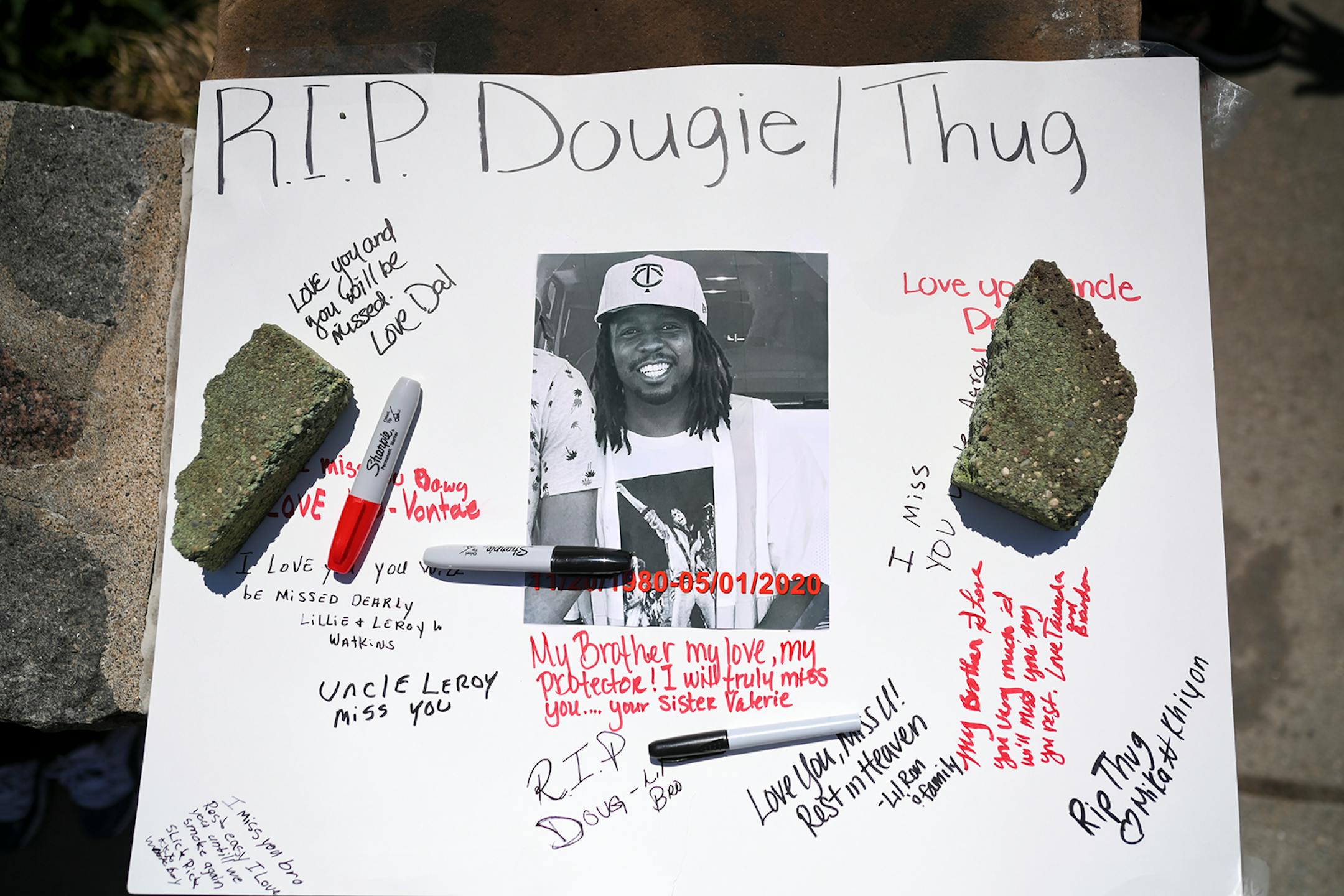 Family and friends wrote messages to Douglas Lewis, who was shot and killed Friday night in St. Paul. A memorial was held for Lewis, who was shot and killed Friday night, on Sunday, May 3, 2020 at the Burns Avenue Scenic Overlook in St. Paul, Minn.