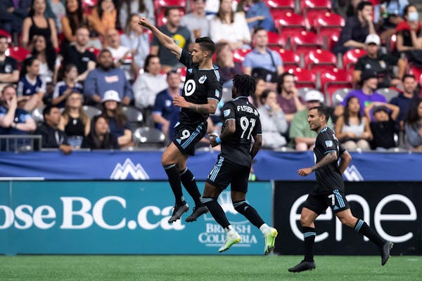 Minnesota United's Luis Amarilla, Oniel Fisher and Franco Fragapane celebrate Amarilla's goal against the Whitecaps during the second half Friday