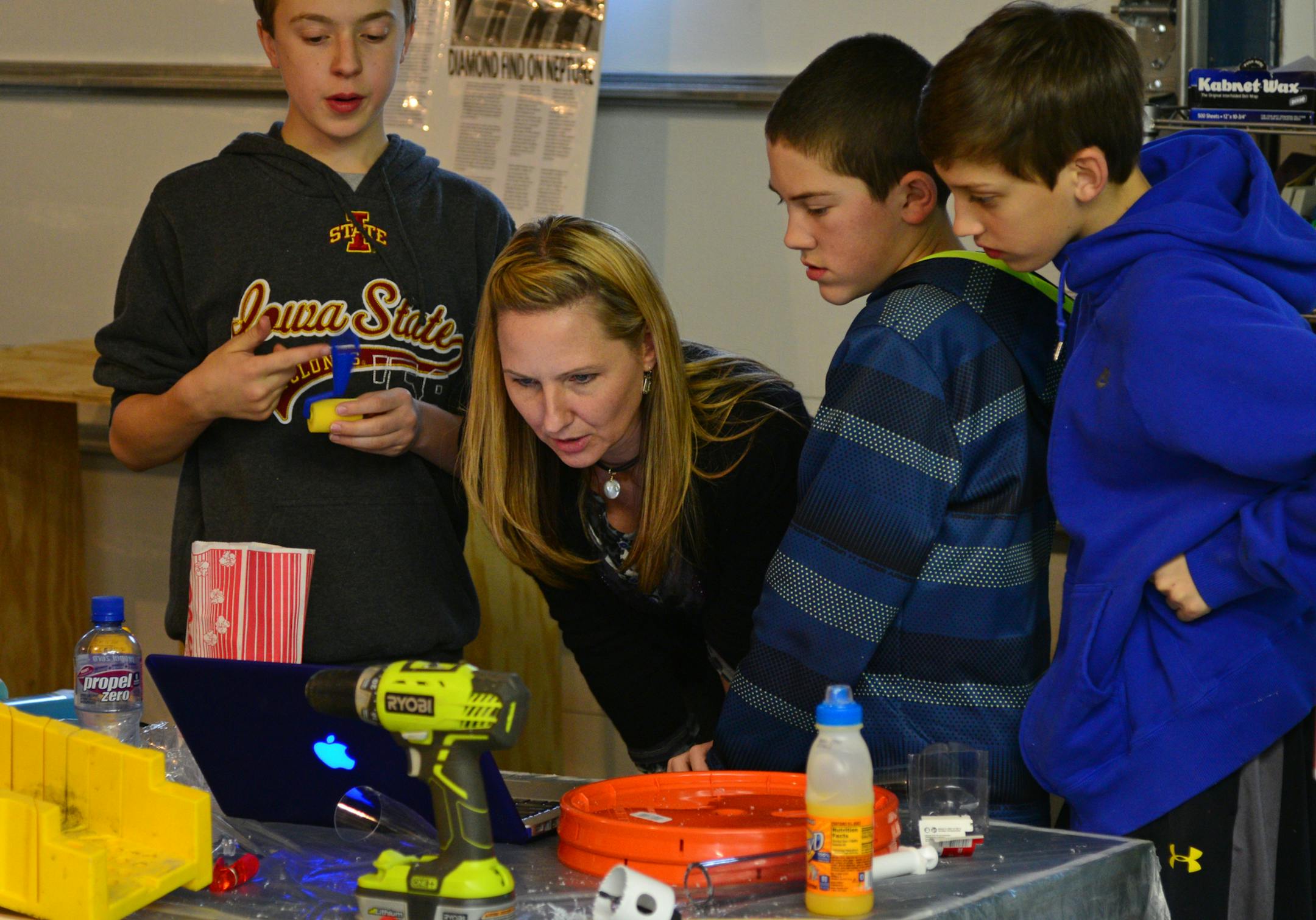 Darla Agard is team manager of 2 Destination Imagination teams . She looked over a project that from left to right Jacob Zuzek, Michael Carlin and Cole Anderson are creating in the garage lab. ]Destination Imagination is a program for students of all ages that encourages creative problem solving and teamwork. Nine teams from Rosemount -Apple Valley-Eagan will attend global finals after placing in the top three in their category at state finals last week. This is a profile of two teams from Dakot