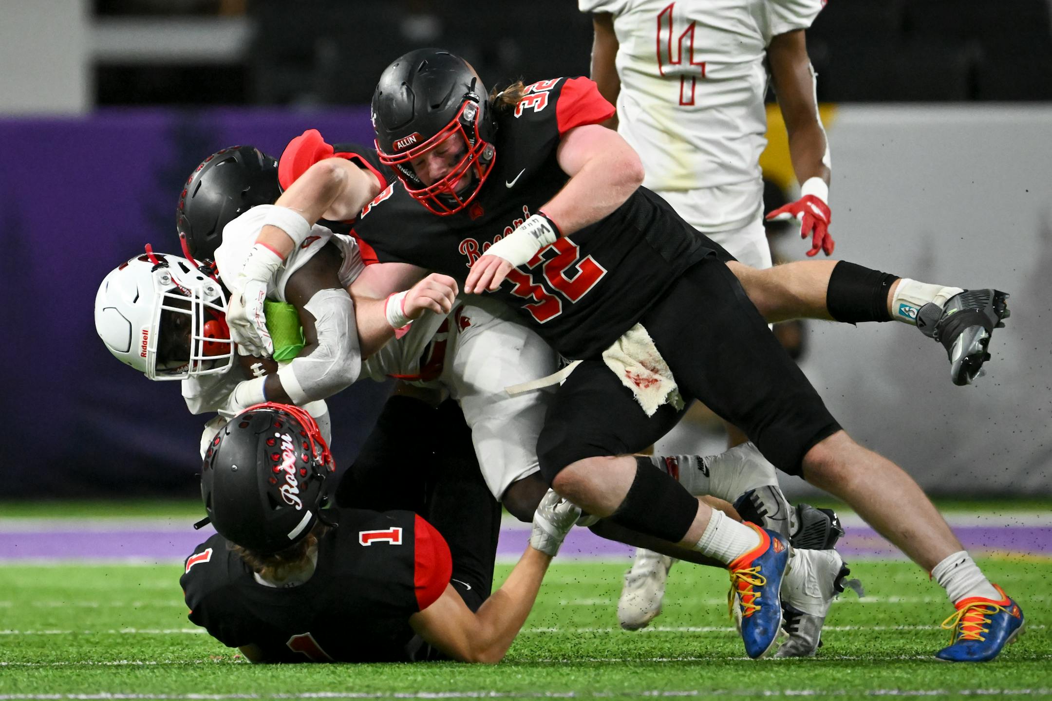 Simley wide reciever La'tayvion McCoy-Nunn (2) runs the ball for a first down as he's tackled by Rocori defensive back Will Steil (1) and linebacker Blake Tylutki (32) during the first half.