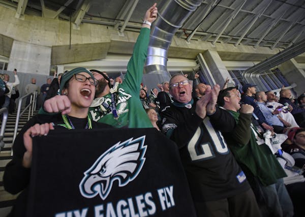 Diana Gonzalez and Joseph Bonner from Philadelphia celebrated after the Eagles scored a touchdown in the third quarter.
