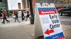 People walk from the Democratic-Farmer-Labor Party's early voting rally to a voting center in Minneapolis Friday, Sept. 23, 2016. Friday kicked off th
