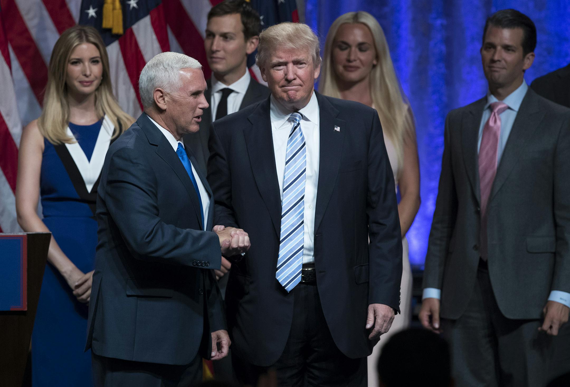 Republican presidential candidate Donald Trump, right, shakes hands with Gov. Mike Pence, R-Ind., during a campaign event to announce Pence as the vice presidential running mate on, Saturday, July 16, 2016, in New York. (AP Photo/Evan Vucci) ORG XMIT: MIN2016072013090530