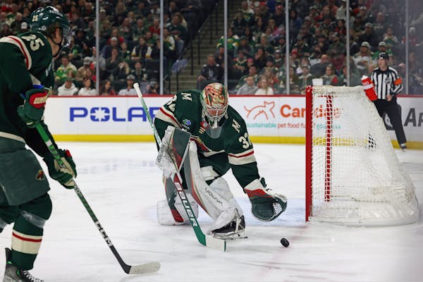 Minnesota Wild goaltender Filip Gustavsson (32) stops the puck during the second period of an NHL hockey game against the Chicago Blackhawks, Saturday