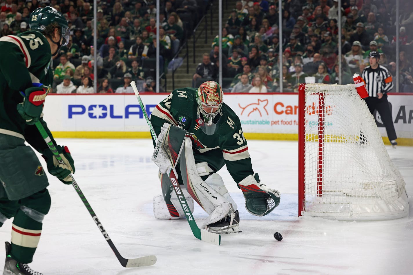 Minnesota Wild goaltender Filip Gustavsson (32) stops the puck during the second period of an NHL hockey game against the Chicago Blackhawks, Saturday, March 25, 2023, in St. Paul, Minn. (AP Photo/Stacy Bengs)