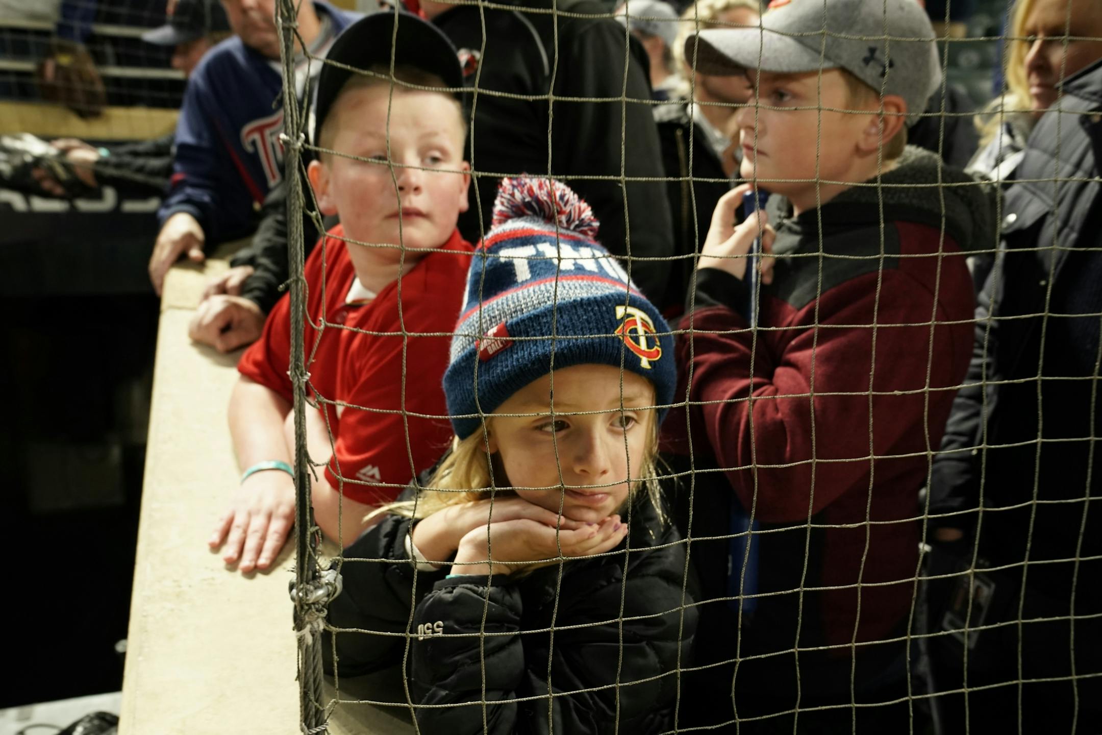 Hailey Detlefsen , 7, and Anthony Hartmann, 10, watched the end of the game as the Twins lose to the New York Yankees.