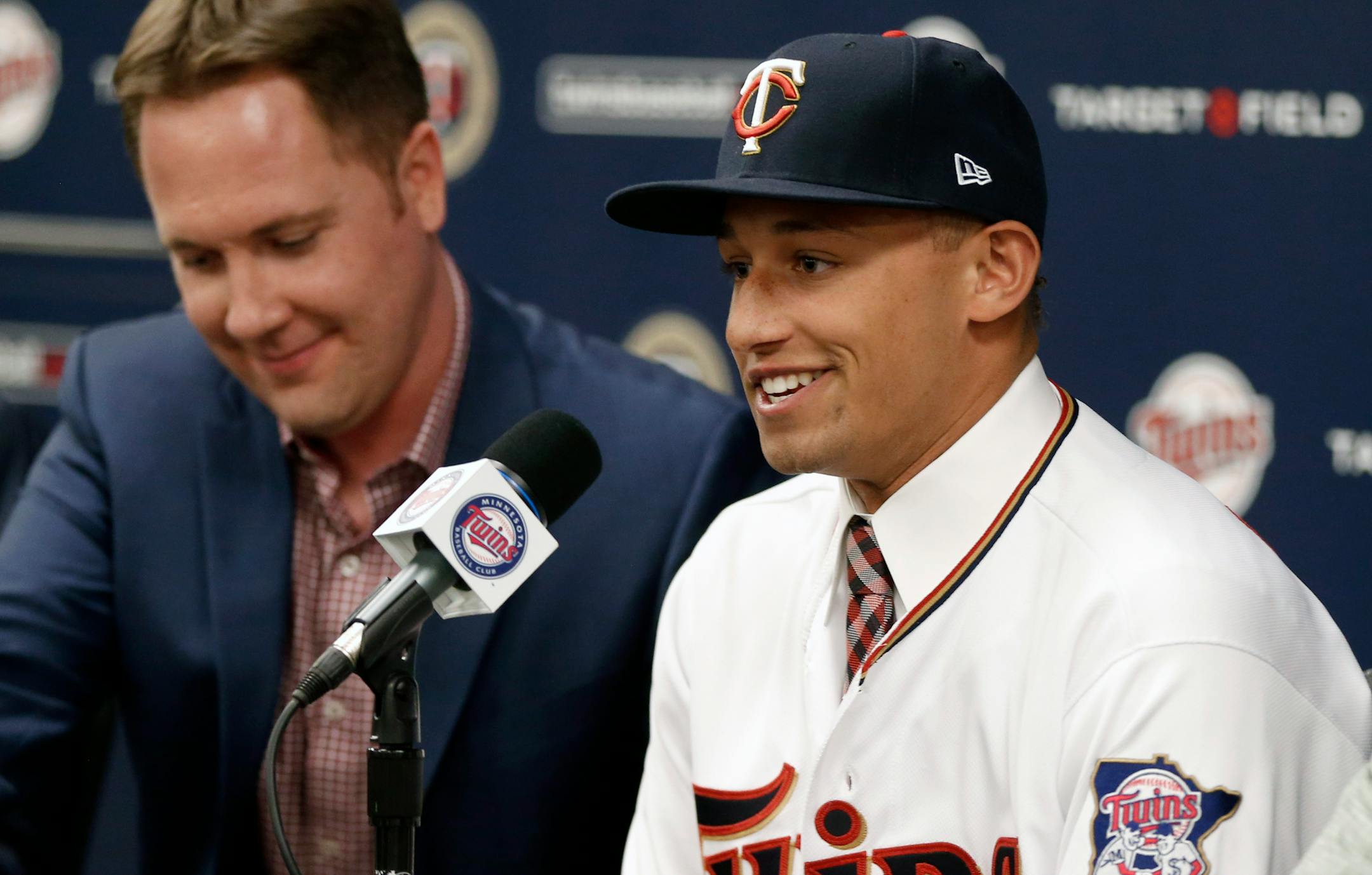 Twins chief baseball officer Derek Falvey, left, listens as first overall MLB draft pick Royce Lewis, addresses the media between a double-header with the Twins and Cleveland Indians, Saturday, June 17, 2017, in Minneapolis.