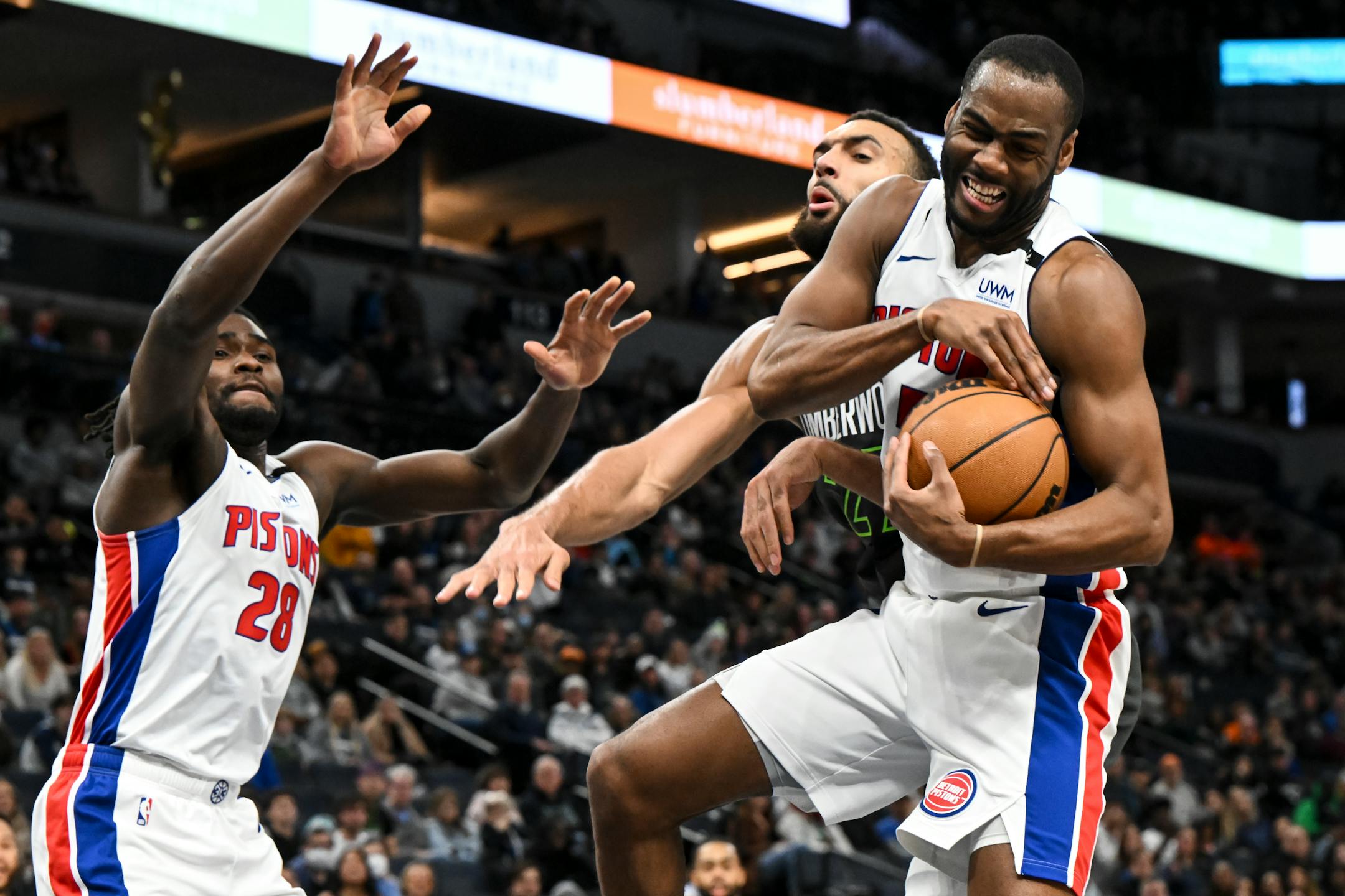 Detroit Pistons guard Alec Burks (5) pulled down a defensive rebound as Minnesota Timberwolves center Rudy Gobert (27) missed an opportunity to grab the ball during second half.