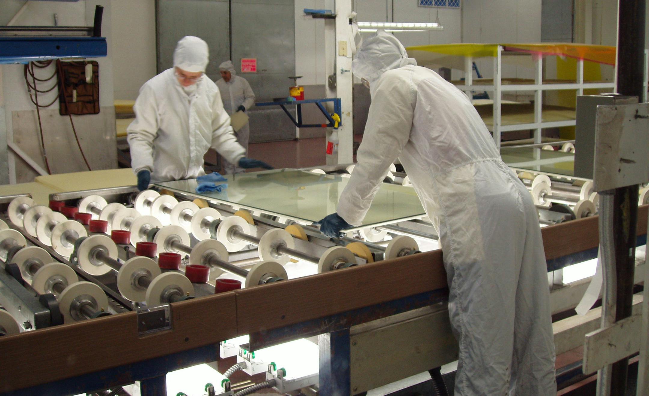 Workers in Viracon's building glass factory in Owatonna laminate sheets of glass into windows that will become CyberShield protected, meaning they will block out all Wi-Fi transmissions and prevent easvesdropping and data theft.