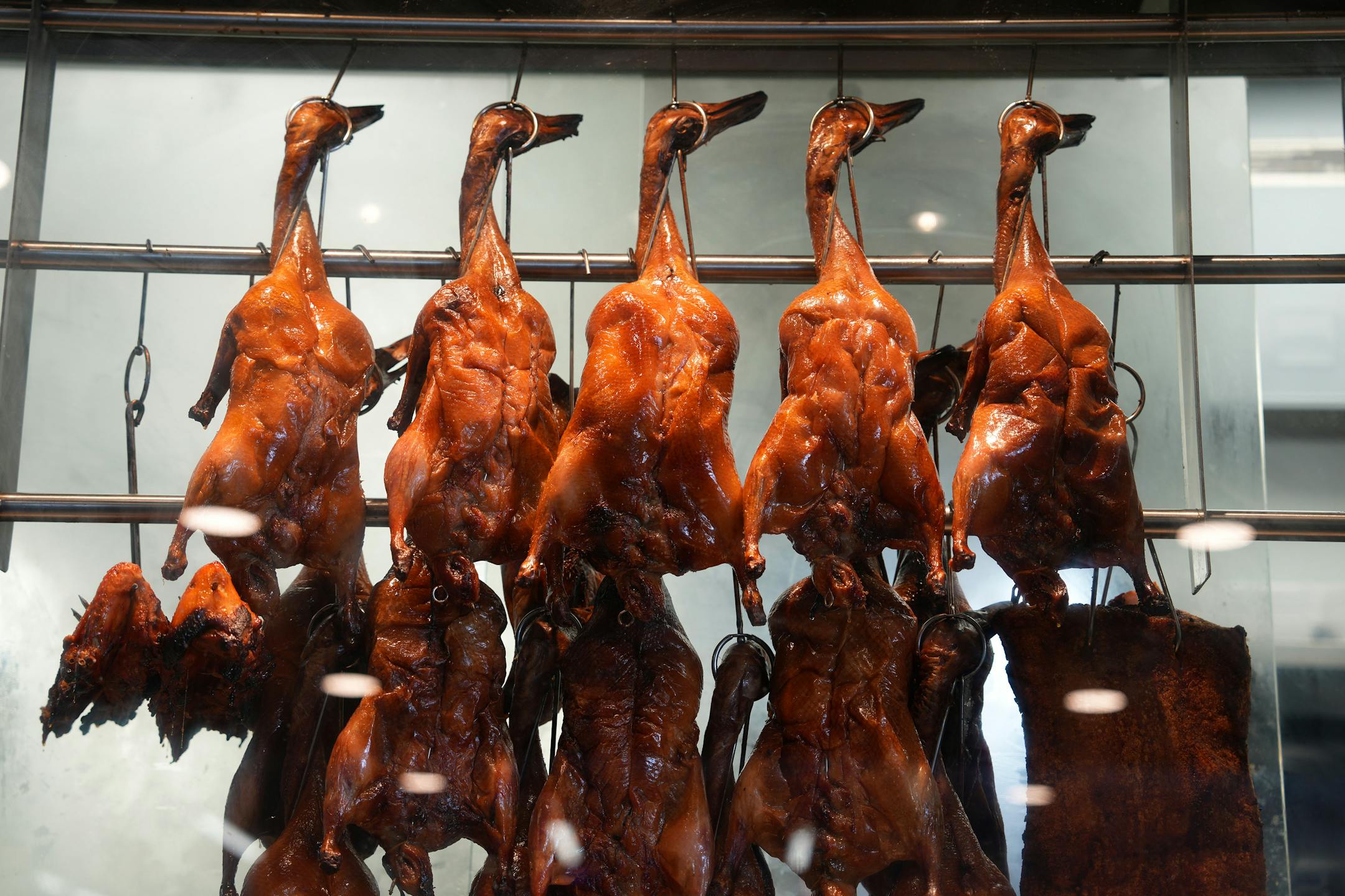 Ducks hang in the window at Home Taste in the new Asia Mall.