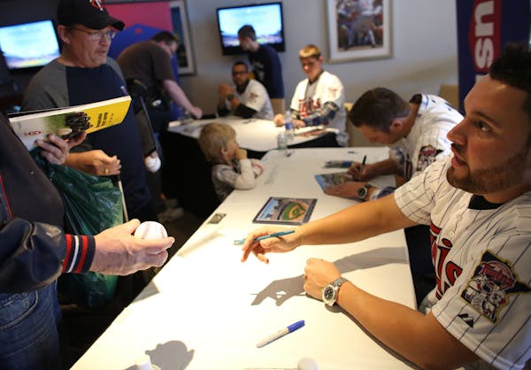 Twin Ricky Nolasco handed back a signed ball to a fan during the first day of TwinFest at Target Field in Minneapolis Friday, January 22, 2013. ] (KYN