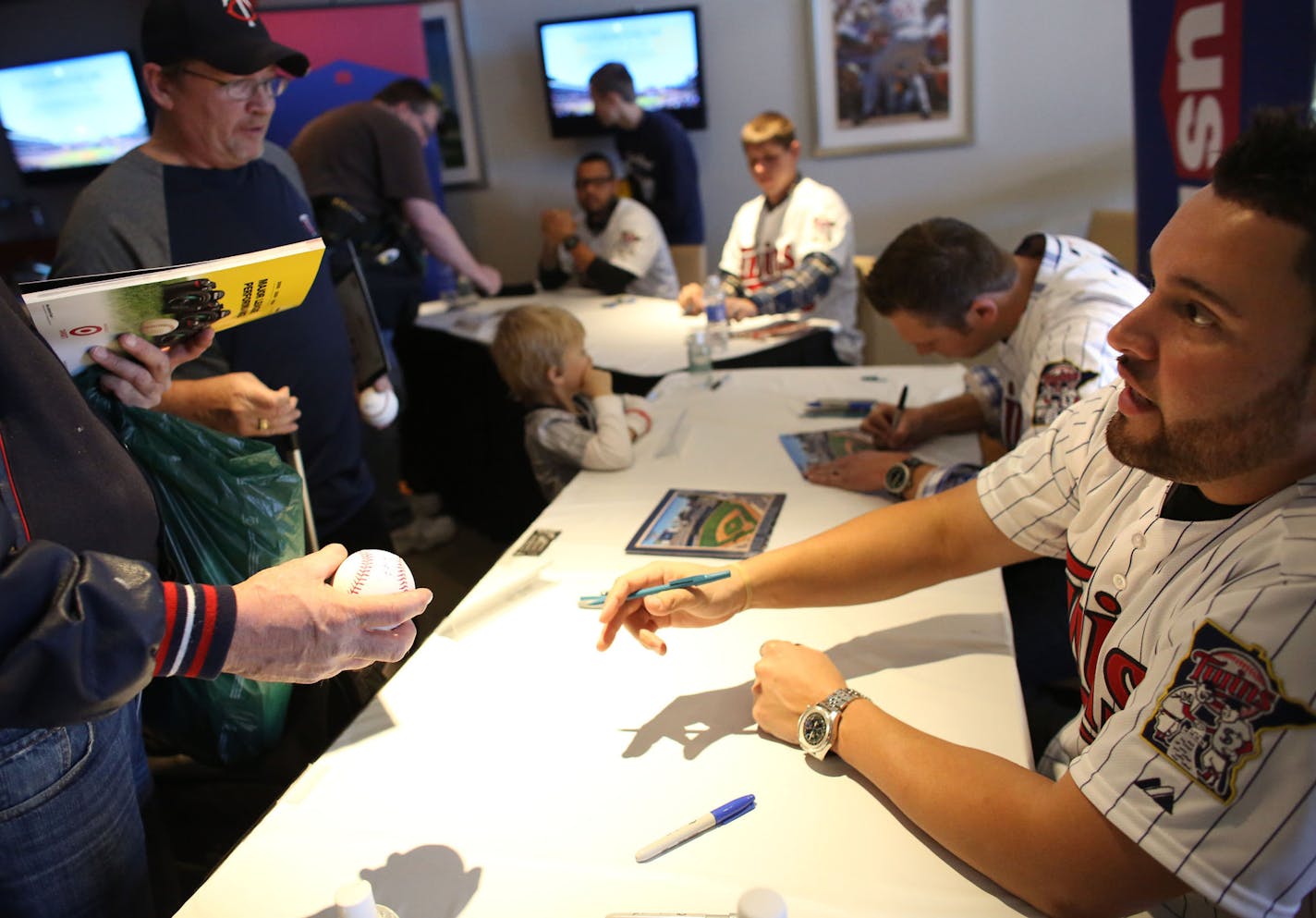 Twin Ricky Nolasco handed back a signed ball to a fan during the first day of TwinFest at Target Field in Minneapolis Friday, January 22, 2013. ] (KYNDELL HARKNESS/STAR TRIBUNE) kyndell.harkness@startribune.com