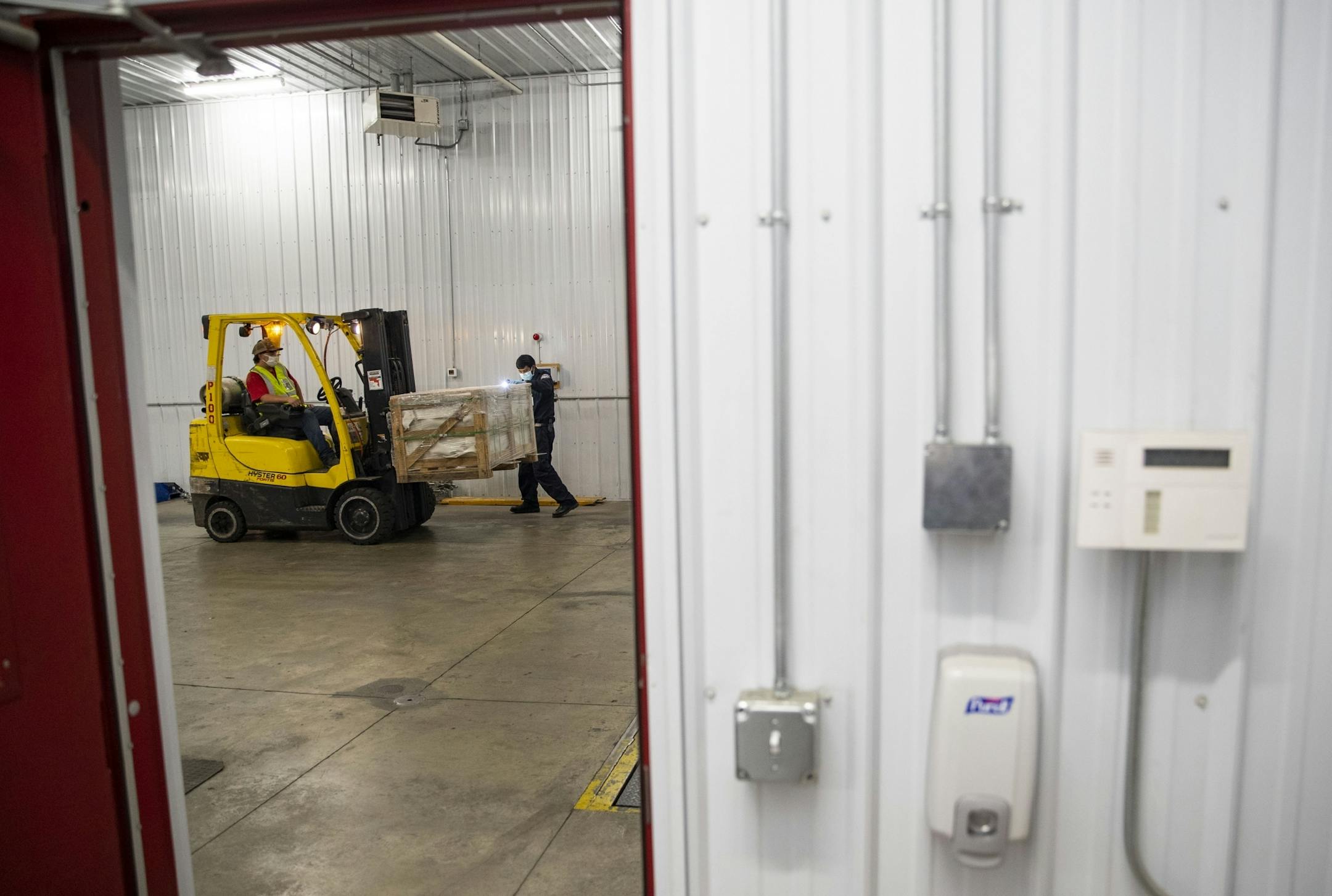 A U.S. Customs and Border Protection agriculture specialist searched the exterior of a box for bugs and other small pests to be sent in for analysis to determine if they pose a significant risk to the goods.