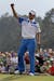 Amateur Guan Tianlang, of China, celebrates after a birdie putt on the 18th green during the first round of the Masters golf tournament Thursday, Apri