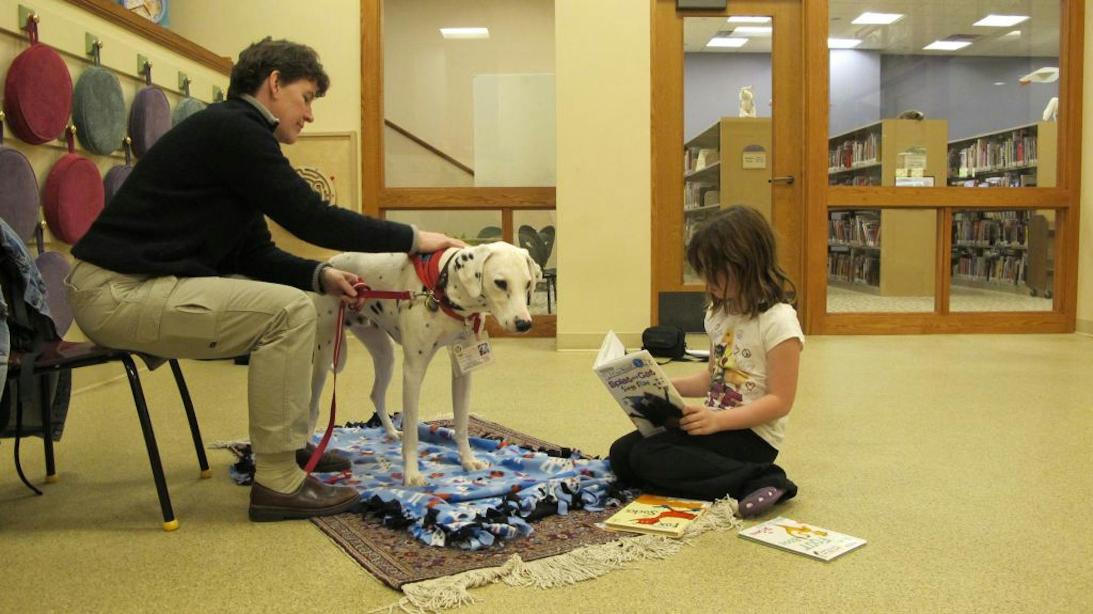 Dalmation Casey at the Stillwater Public Library's Read to a Dog program. Photo: Tim Harlow