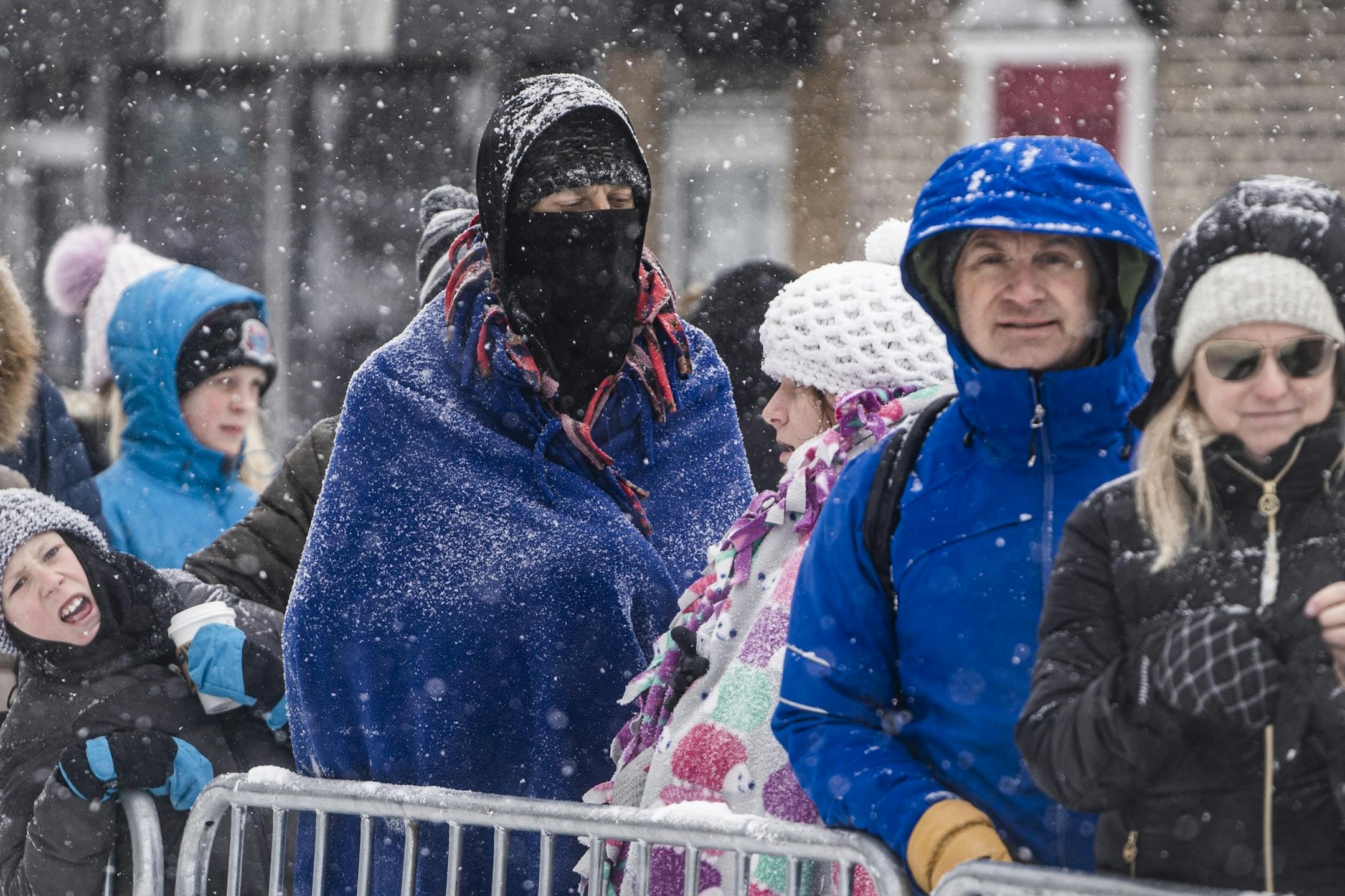 Spectators awaited the start of the Klondike Dog Derby .