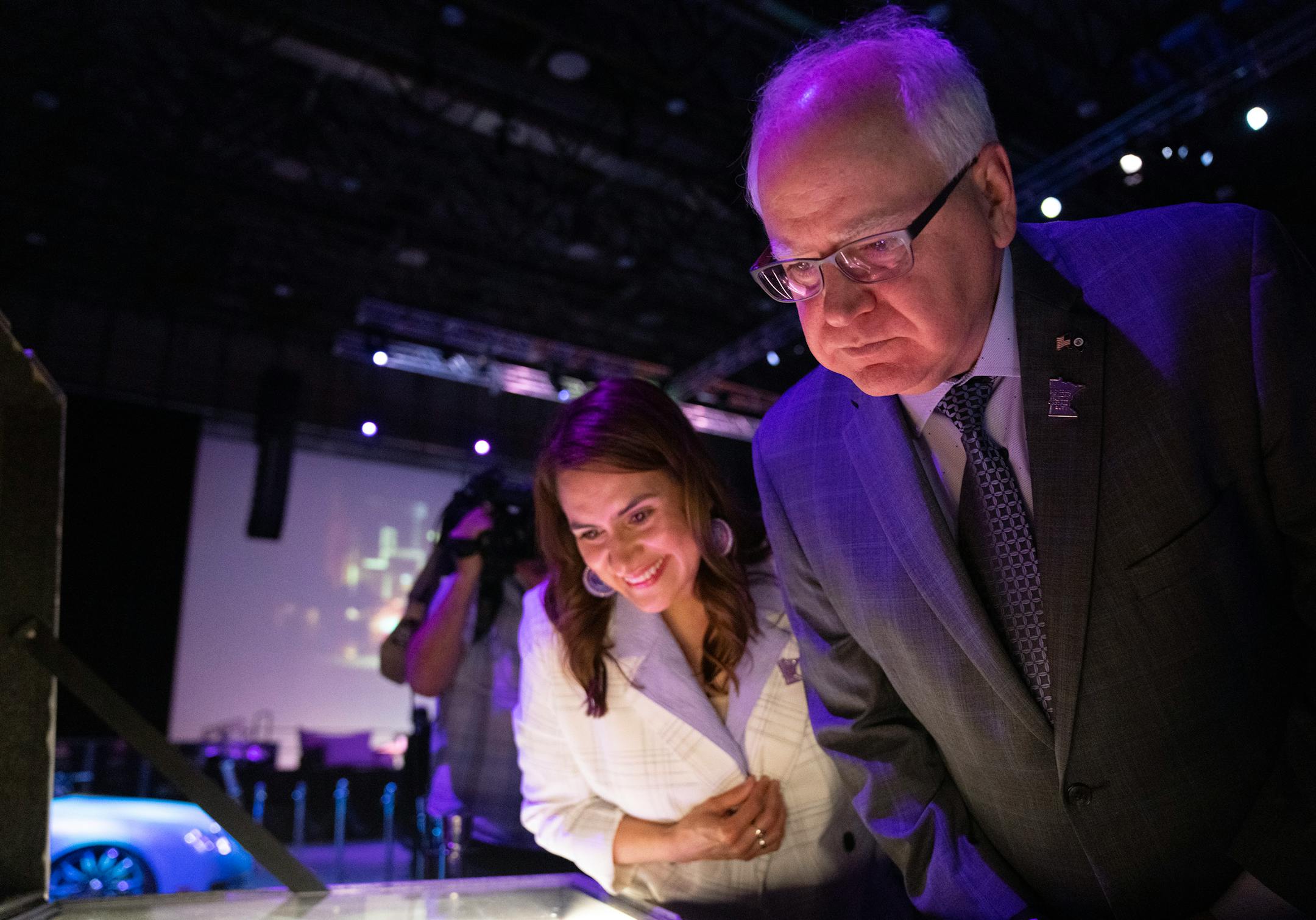 Minnesota Lieutenant Governor Peggy Flanagan and Governor Tim Walz look at Prince artifacts at Paisley Park.