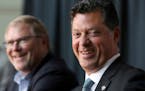 Minnesota Wild NHL hockey team owner Craig Leipold, left, laughs with new team general manager Bill Guerin at an introductory press conference in St. 