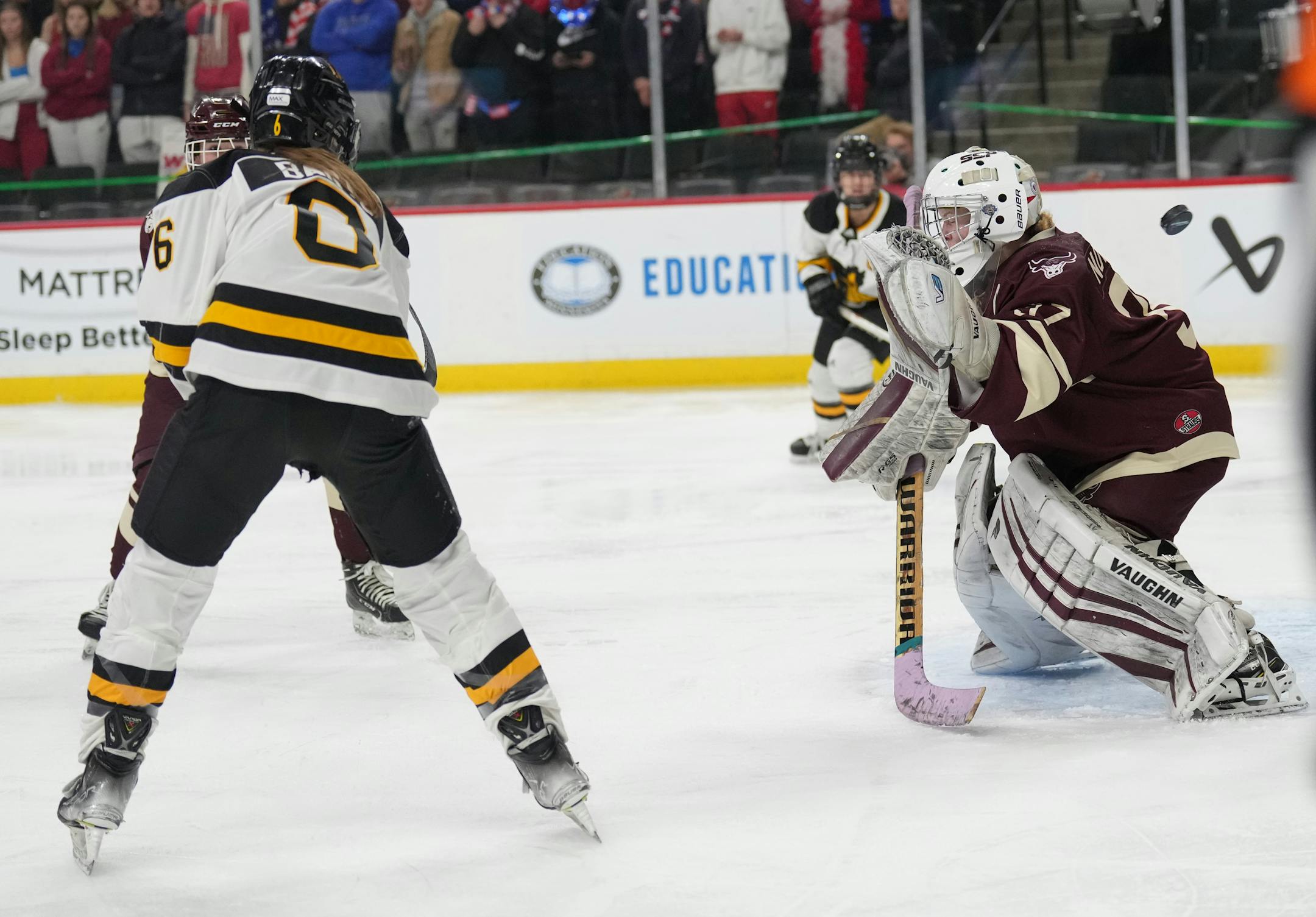 The puck gets past South St. Paul goaltender Delaney Norman (37) after a shot by Warroad forward Talya Hendrickson (13) in the first period.