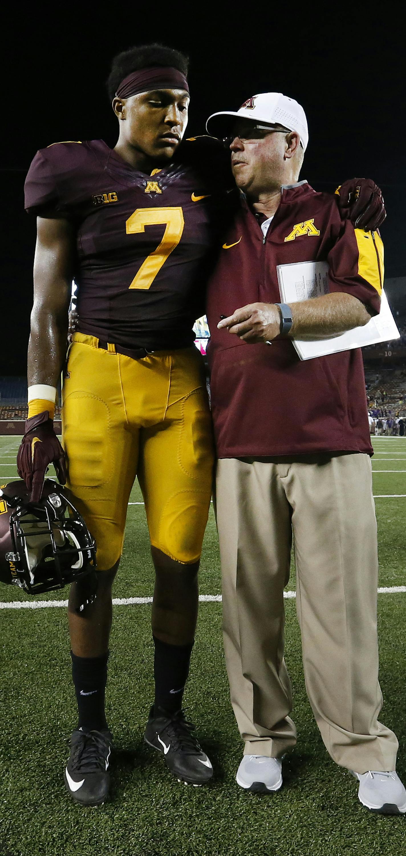 Minnesota defensive back Demaryius Thomas (7) stood with head coach Jerry Kill as the Hail Minnesota was sung at the end of the game. ] CARLOS GONZALEZ cgonzalez@startribune.com - September 3, 2015, Minneapolis, MN, TCF Bank Stadium, NCAA Football, Big 10, University of Minnesota Golden Gophers vs. Texas Christian University TCU Horned Frogs