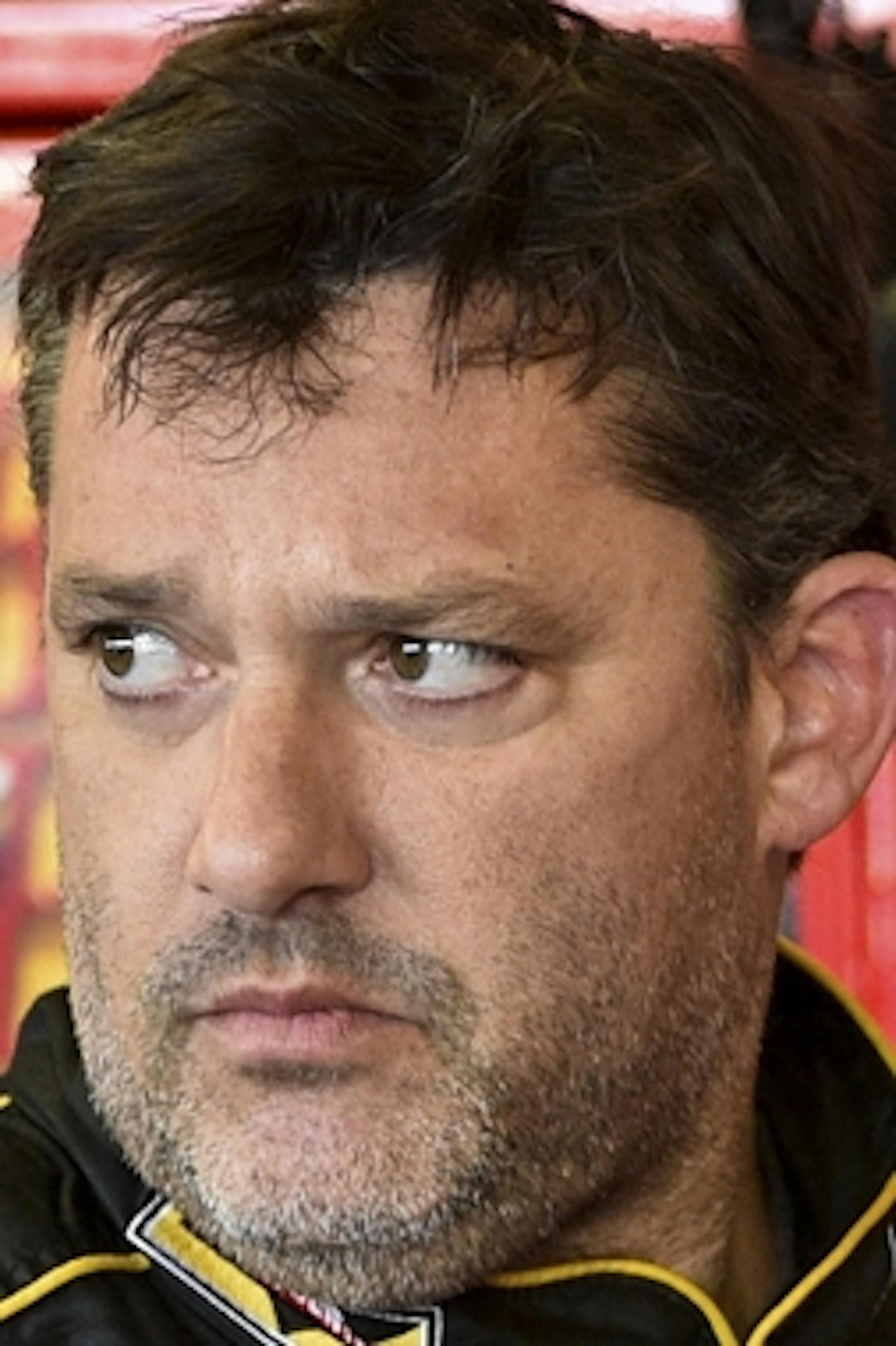 In this Friday, Aug. 8, 2014 photograph, Tony Stewart stands in the garage area after a practice session for Sunday's NASCAR Sprint Cup Series auto race at Watkins Glen International, in Watkins Glen N.Y. Stewart struck and killed Kevin Ward Jr., 20, a sprint car driver who had climbed from his car and was on the track trying to confront Stewart during a race at Canandaigua Motorsports Park in upstate New York on Saturday night. Ontario County Sheriff Philip Povero said his department's investig