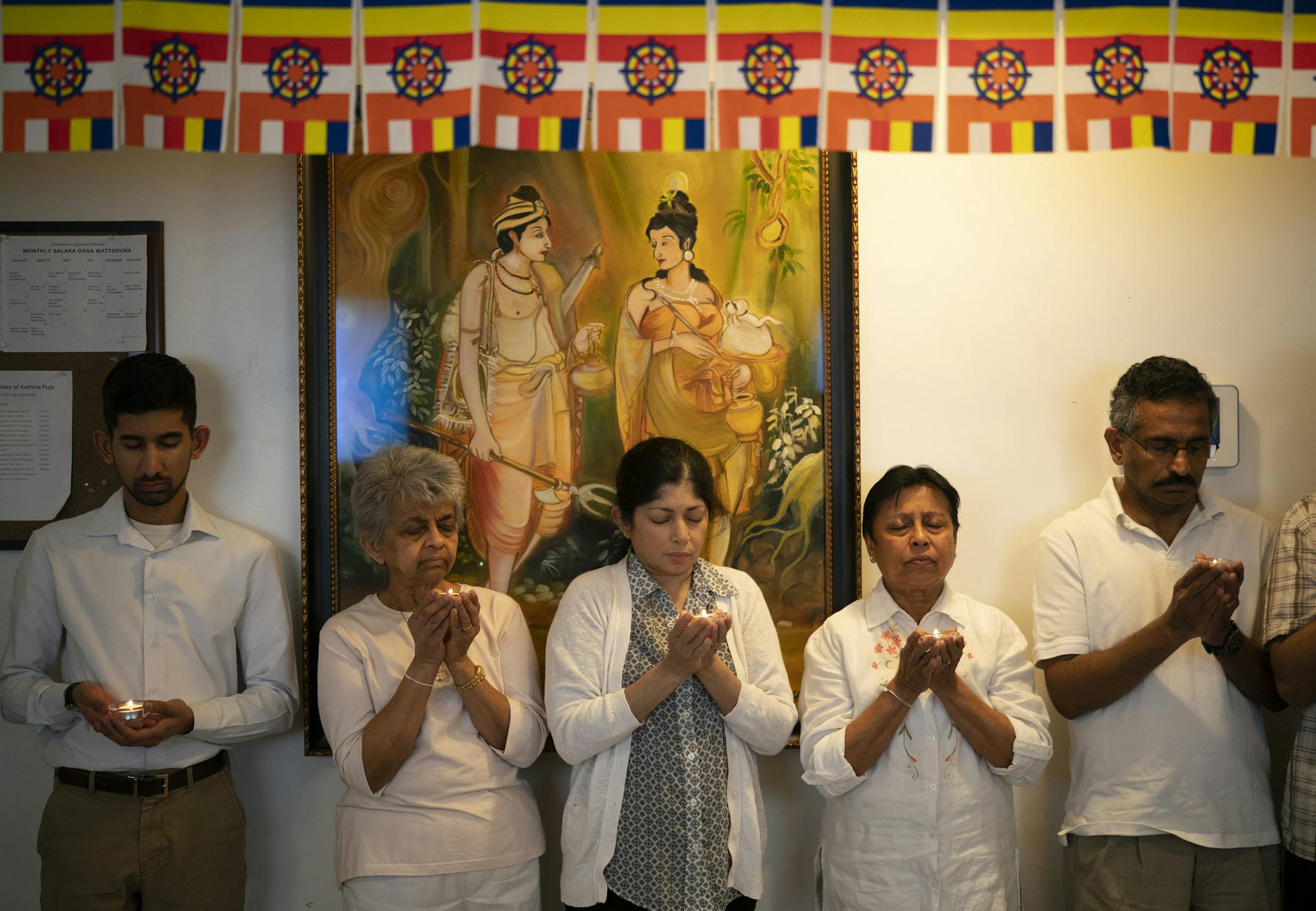 People attending the memorial service held candles during a moment of silence to remember the bombing victims.