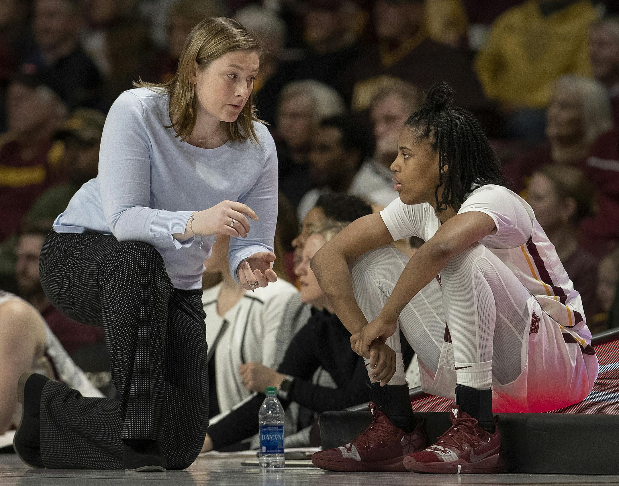 Gophers coach Lindsay Whalen spoke with Kenisha Bell during a game at Williams Arena last month.