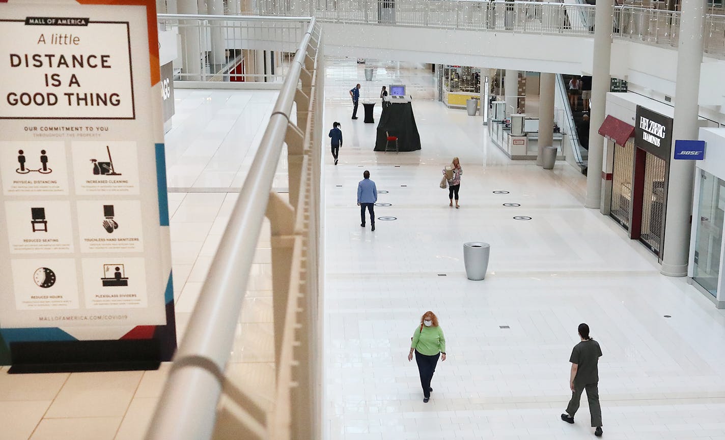 The MOA opened again for the first time since mid-March, where most shoppers wore face masks and where social distancing signs abounded, Wednesday, June 10, 2020, in Bloomington, MN.] DAVID JOLES • david.joles@startribune.com Many small businesses such as fitness centers, bowling alleys and movie theaters are being allowed to open Wednesday with limited capacity as Minnesota begins to loosen gathering restrictions due to COVID-19. On the other end of the spectrum, Mall of America also reopens We