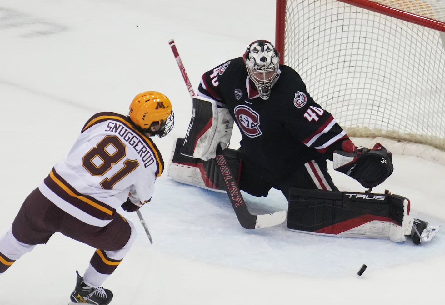 Minnesota forward Jimmy Snuggerud (81) shoots as St. Cloud State goaltender Jaxon Castor (40) makes a save in Minneapolis, Minn., on Sunday, Jan. 8, 2023. No. 3 Gophers vs. No. 4 St. Cloud State in men's hockey at Mariucci Arena. ] RICHARD TSONG-TAATARII • richard.tsong-taatarii @startribune.com