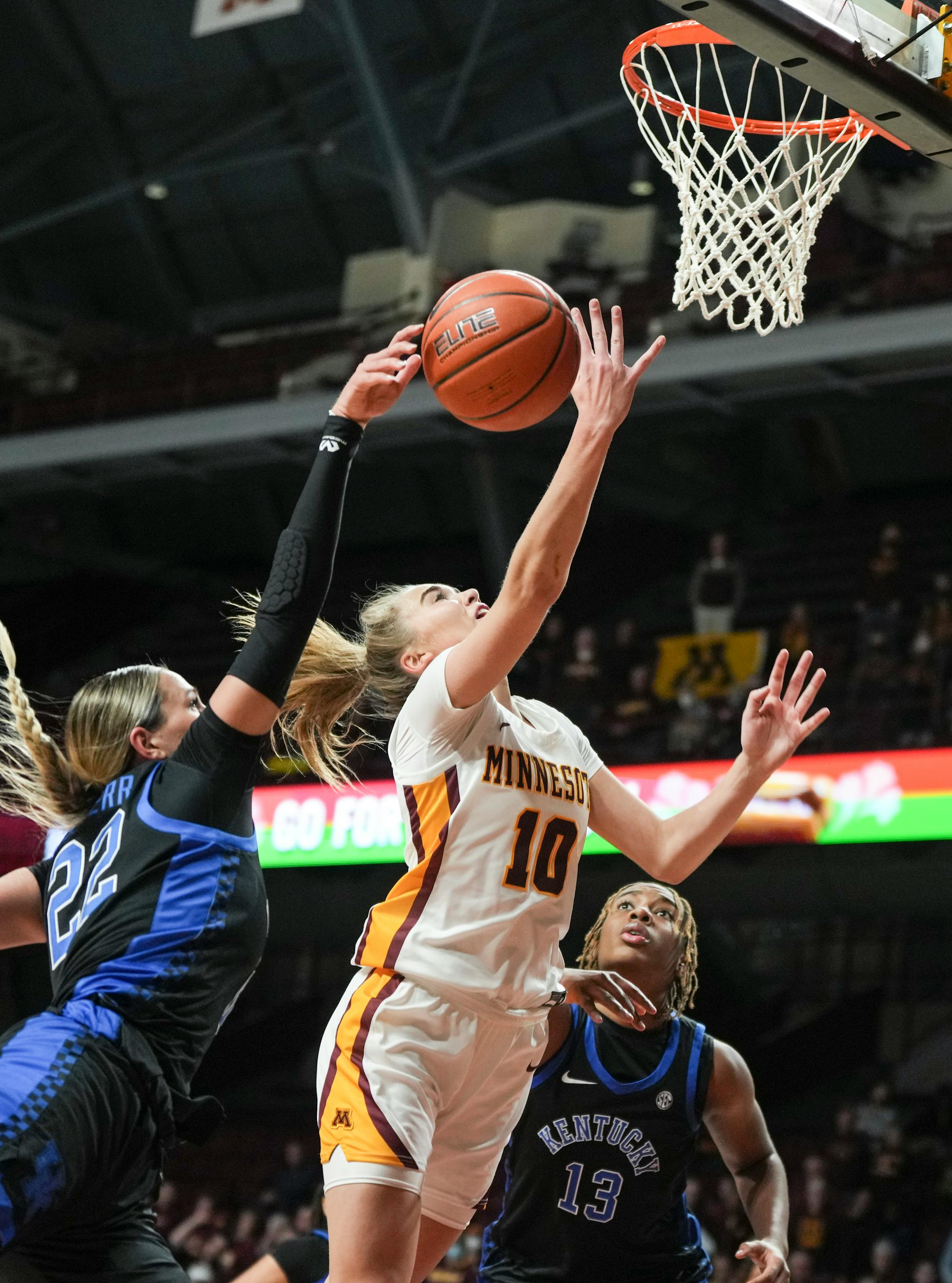 Kentucky Wildcats guard Maddie Scherr (22) knocks the ball from Minnesota Gophers guard Mara Braun (10) in the first half.