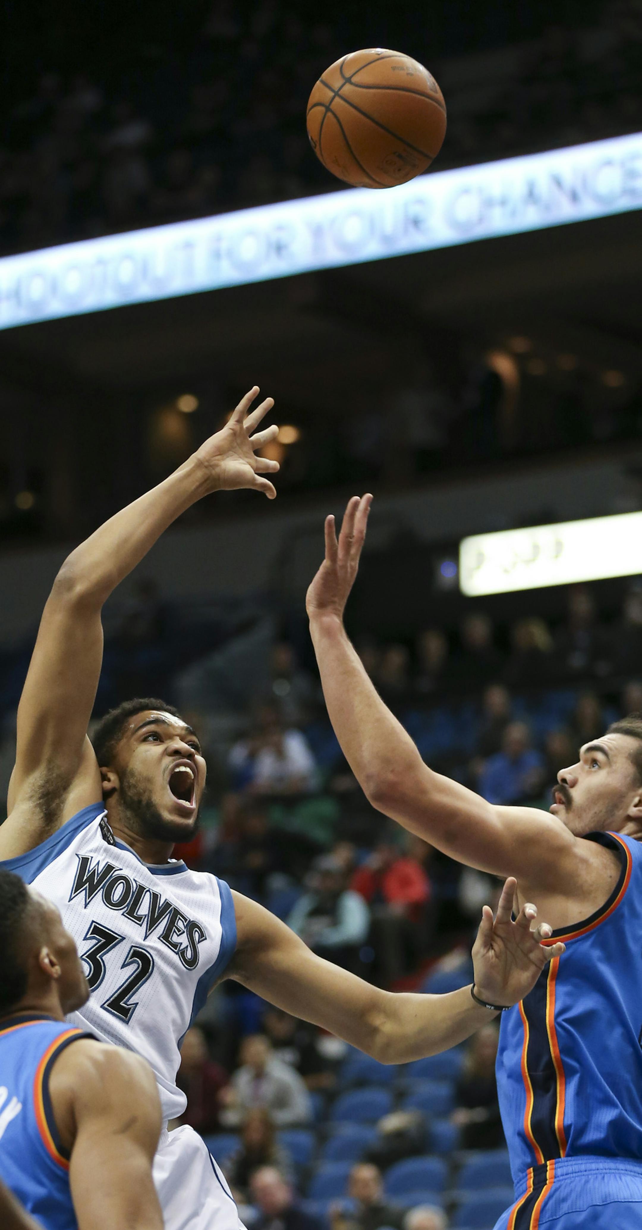 Timberwolves center Karl-Anthony Towns (32) took a first quarter shot over Oklahoma City Thunder center Steven Adams (12) Wednesday night. ] JEFF WHEELER ï jeff.wheeler@startribune.com The Minnesota Timberwolves faced the Oklahoma City Thunder in an NBA game Wednesday night, January 27, 2016 at Target Center in Minneapolis.