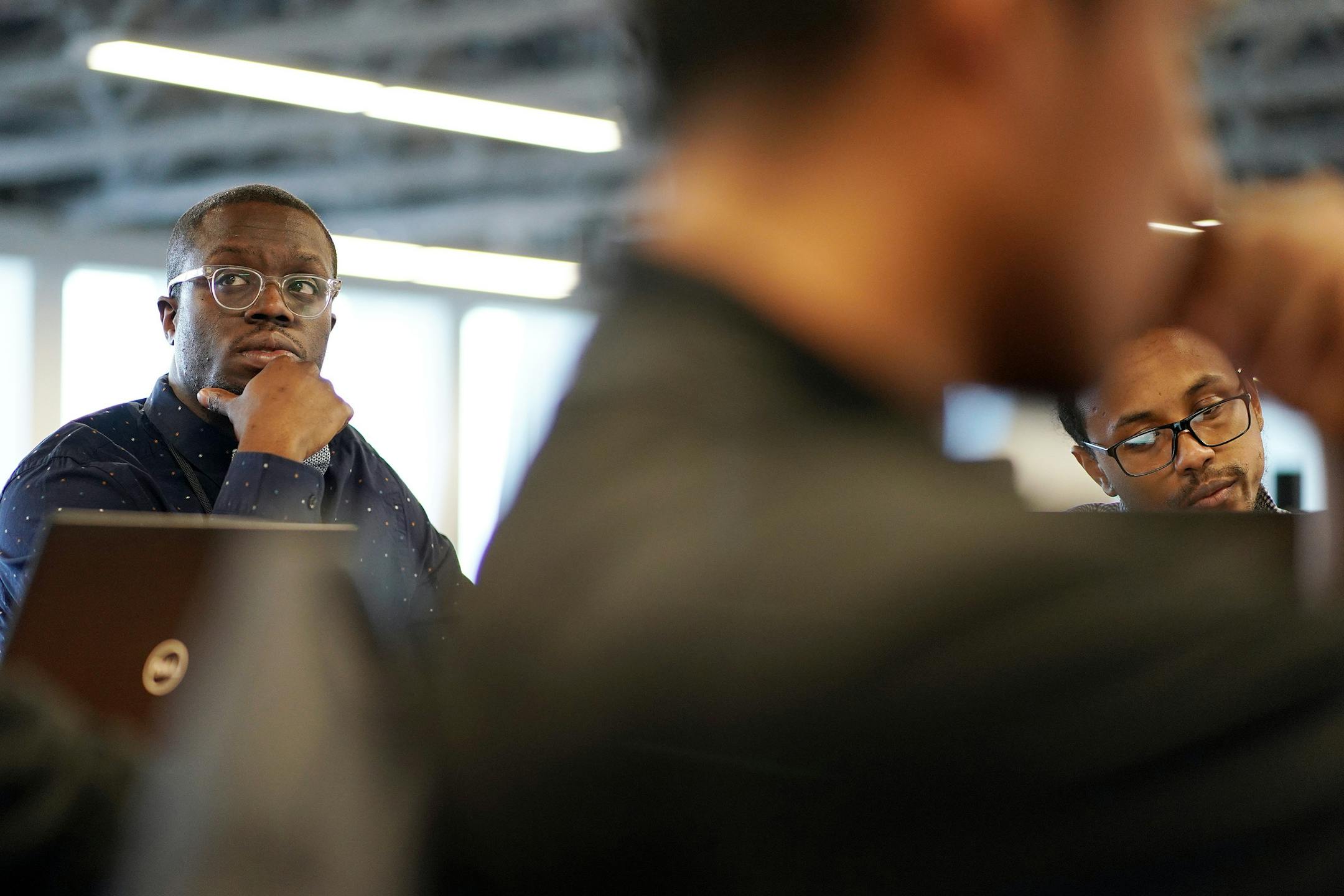 Gonkama Johnson, left, participated in a training program through Atomic Data Thursday. ] ANTHONY SOUFFLE • anthony.souffle@startribune.com Gonkama Johnson participated in a training program through Atomic Data Thursday, Jan. 24, 2019 in Minneapolis. Johnson was born in Minneapolis, the son of Liberian immigrants, and is now now homeless and mourning friends who've lost their lives to suicide and drug overdoses. In a few days Johnson will finish an intensive 20-week information technology