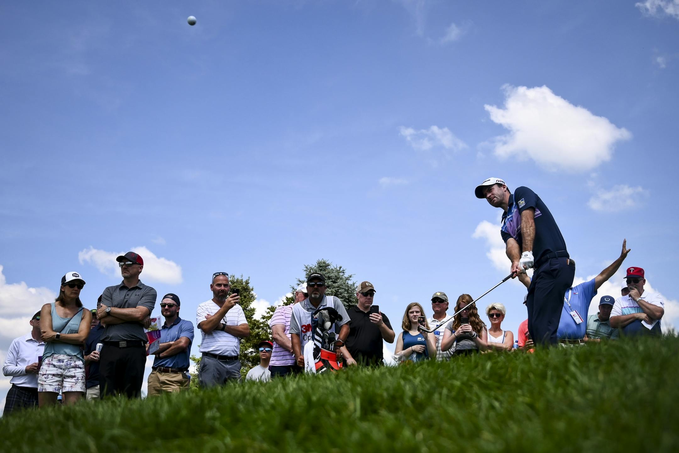 Nick Taylor chipped the ball to the green from the rough on the 9th hole Saturday. He hit for bogey on the hole.