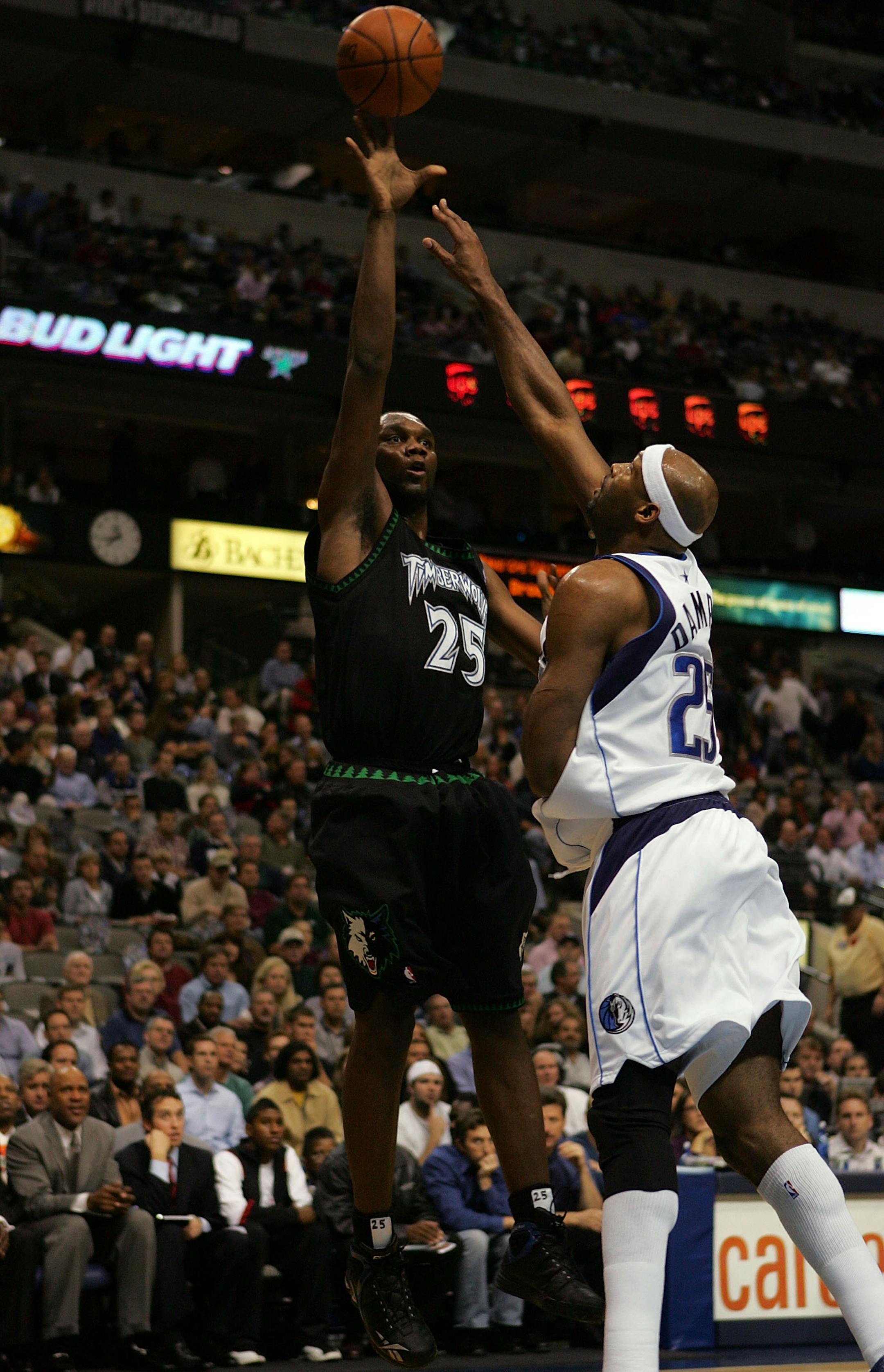 DALLAS - NOVEMBER 28: Forward Al Jefferson #25 of the Minnesota Timberwolves takes a shot against Erick Dampier #25 of the Dallas Mavericks on November 28, 2007 at American Airlines Center in Dallas, Texas. NOTE TO USER: User expressly acknowledges and agrees that, by downloading and/or using this Photograph, user is consenting to the terms and conditions of the Getty Images License Agreement. (Photo by Ronald Martinez/Getty Images)