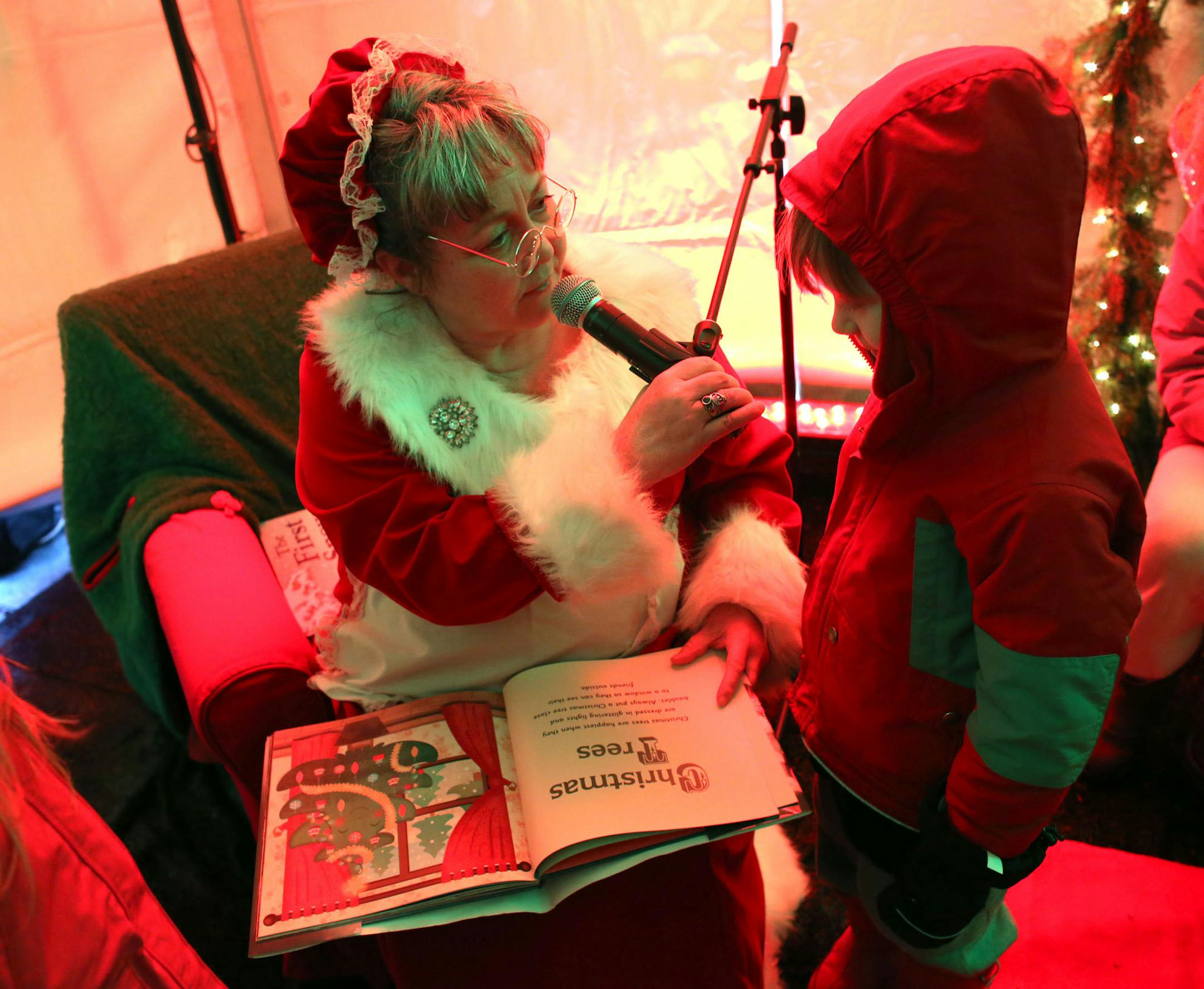 John-Henry, Scheller, 5, of Cottage Grove, helped read a story with Mrs Santa Claus during the Canadian Pacific Holiday Train in Cottage Grove Saturday, December 14, 2013. ] (KYNDELL HARKNESS/STAR TRIBUNE) kyndell.harkness@startribune.com