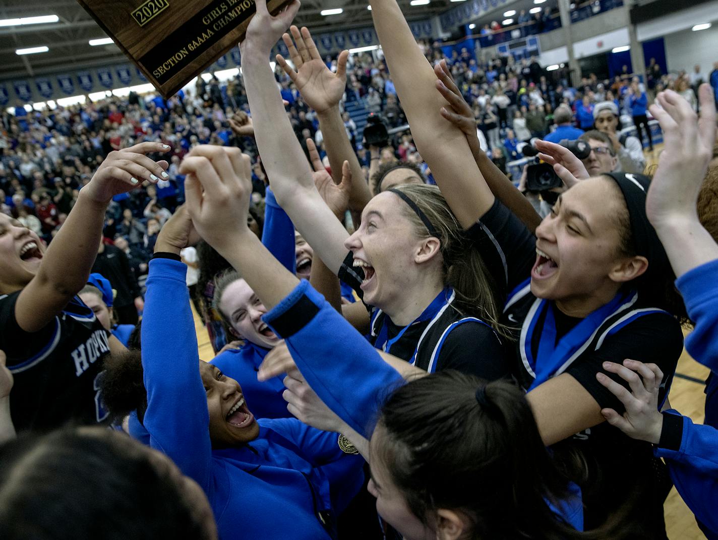 Hopkins&#x2019; Paige Bueckers, center, celebrated with the team after they defeated Wayzata in the Class 4A, Section 6 girls' basketball championship at the Lindbergh Center, Thursday, March 5, 2020 in Hopkins, MN. ] ELIZABETH FLORES &#x2022; liz.flores@startribune.com