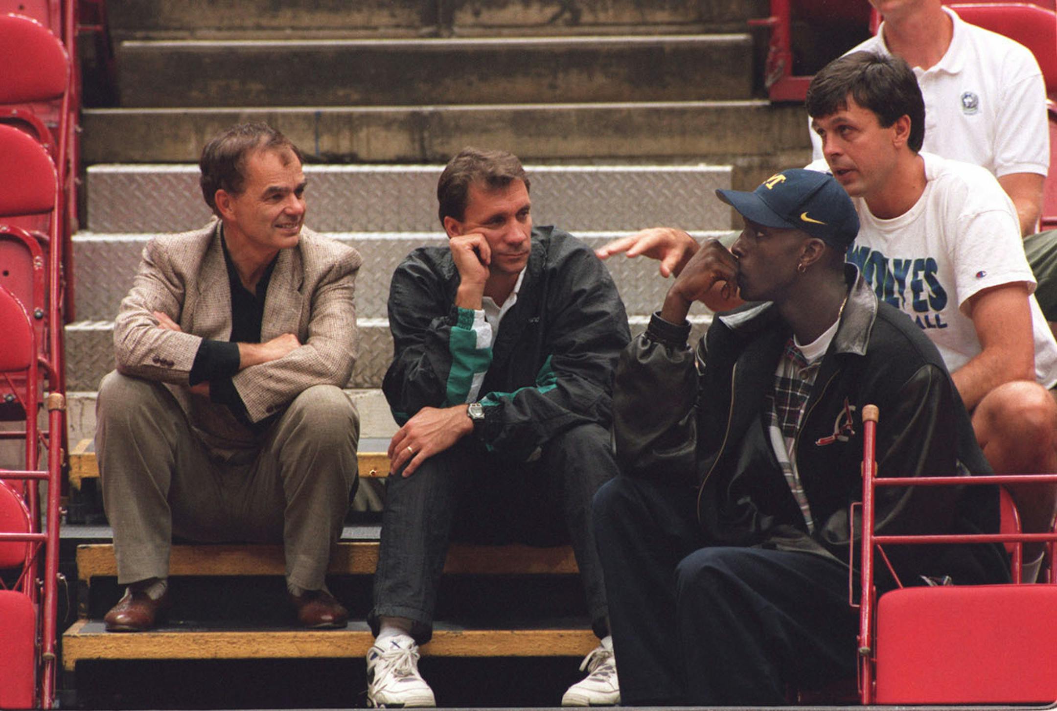 Timberwolves owner Glen Taylor left, Flip Sauders general manger,and Kevin Garnett Wolves first-round pick listen to Kevin McHale at the Target Center.