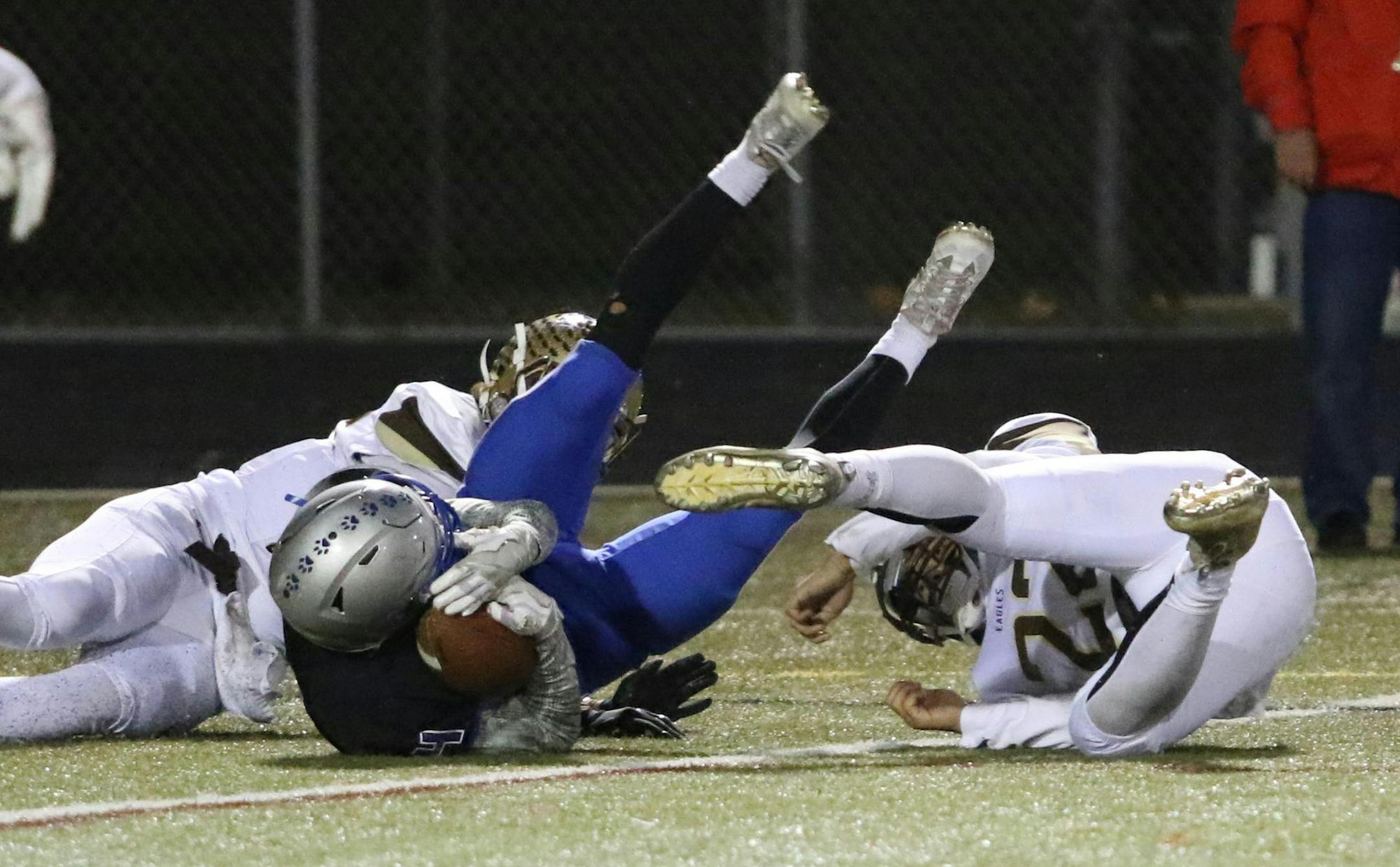 Owatonna's Alex Raichle comes down inside the goal line clutching a 44 yard pass to take the lead with just 18 seconds remaining in regulation. The Huskies defeated Apple Valley 28-24 completing two hail mary's to end both halves of the game.