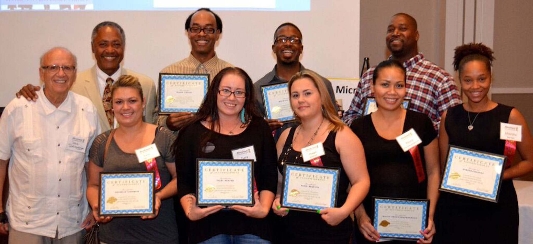 Microgrants founder Joe Selvaggio (far left) and Don Samuels (second from left) with Microgants award winners who have advanced in employment and business at an awards ceremony last fall. ORG XMIT: MIN1602021635223796
