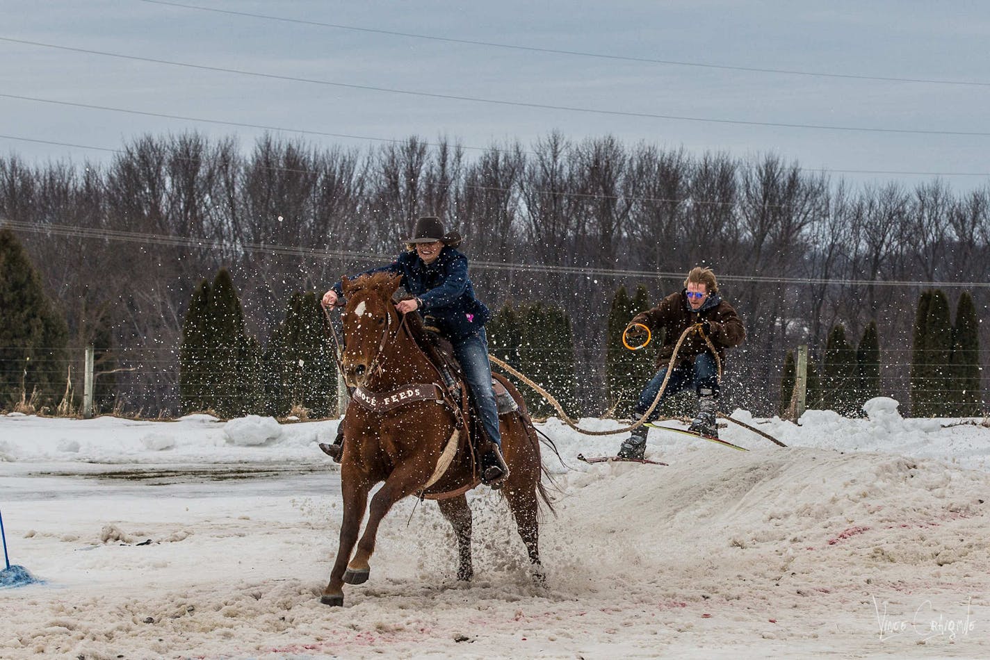 A competitor gets some air time, top, at a horse skijoring competition last year in Zumbrota.