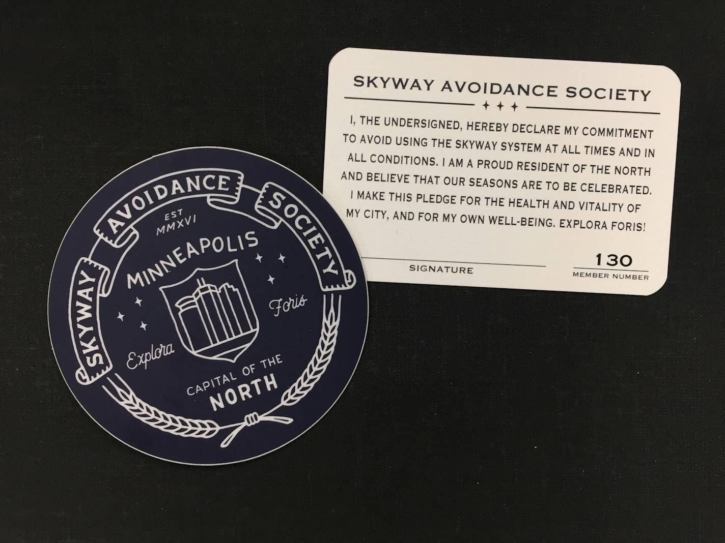 A sticker and membership card for the Skyway Avoidance Society.