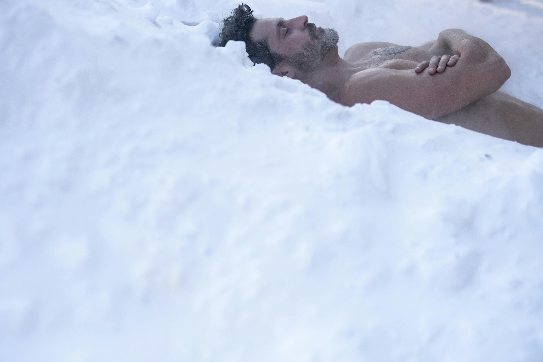 Nick Knutzen, of Minneapolis, laid down in a pile of snow after getting out of the 612 Sauna Society's sauna at Theodore Wirth Park Sunday. "It's amazing, this is the best part," said Knutzen as he rested in the snow.