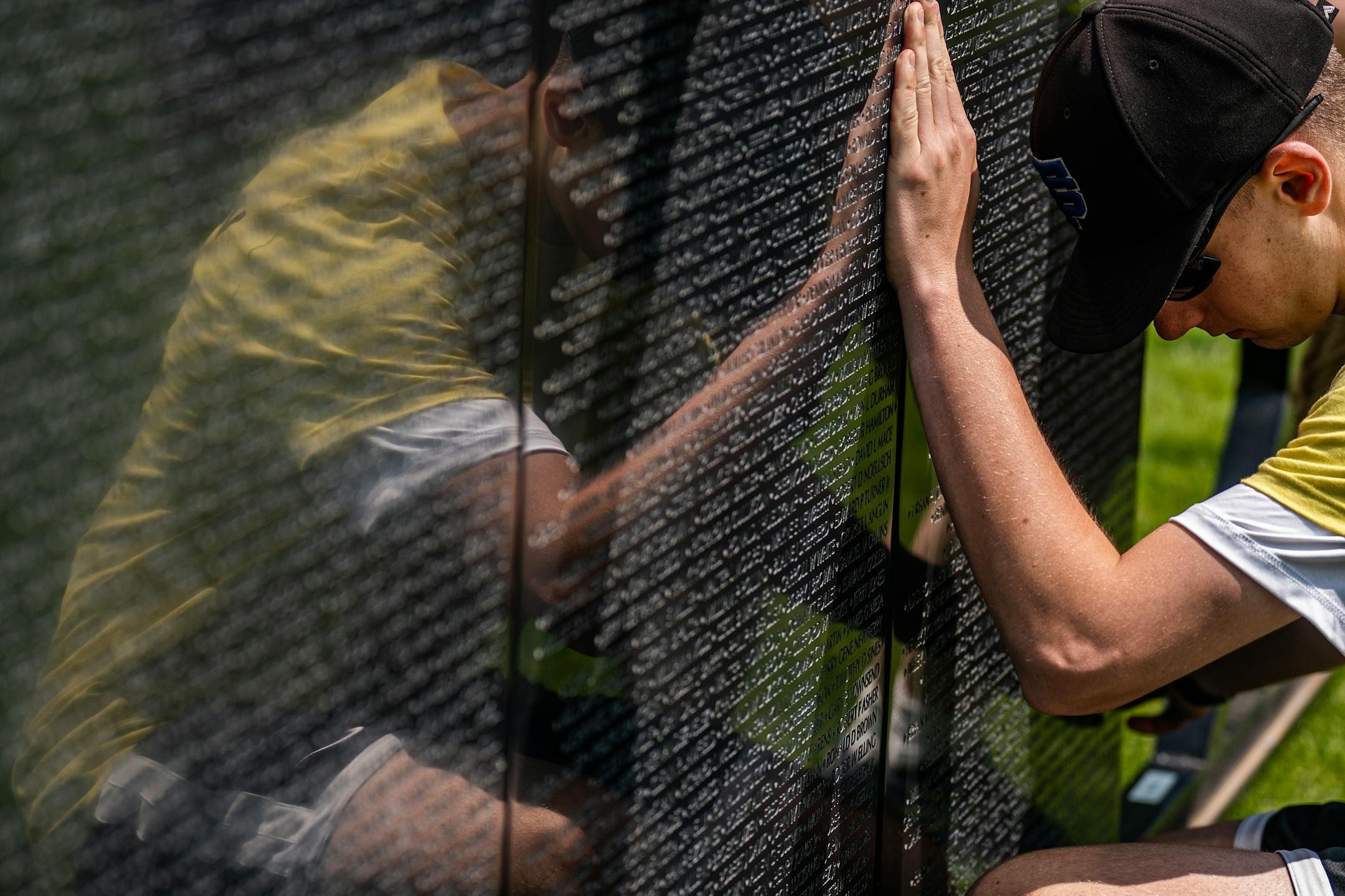 St. Thomas Academy cadets, including future West Point cadet Eric Zauha, help assemble a 3/4 scale of the Wall That Heals that contains 58,281 names of Vietnam Veterans who died in combat.